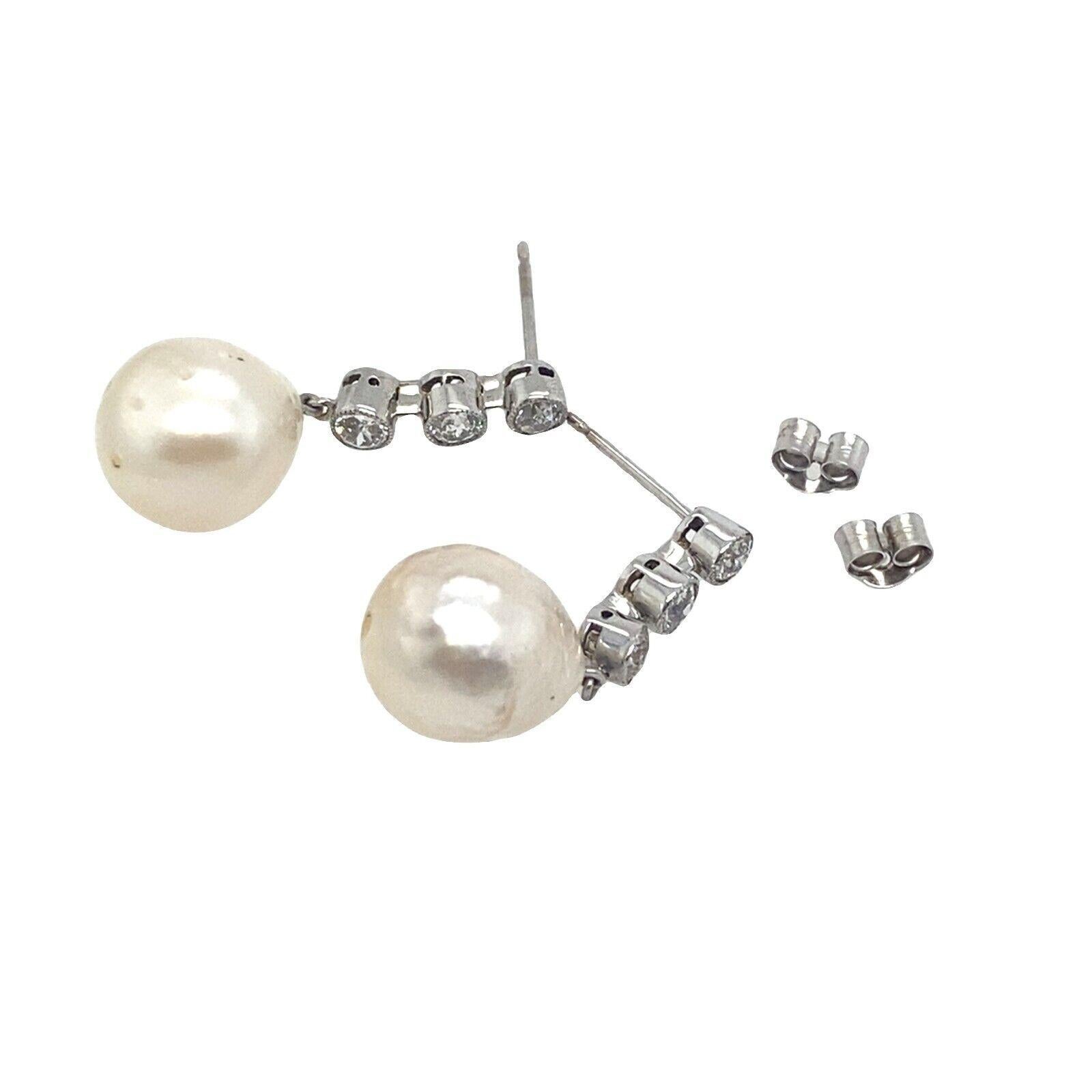 This is a pair of Victorian cut Diamond drop earrings set with 0.60ct Diamonds and 2 Cultured Pearls. This pair is a perfect choice for any occasion to wear as it is stylish and comfortable. It is crafted from 18ct White Gold with peg and screw
