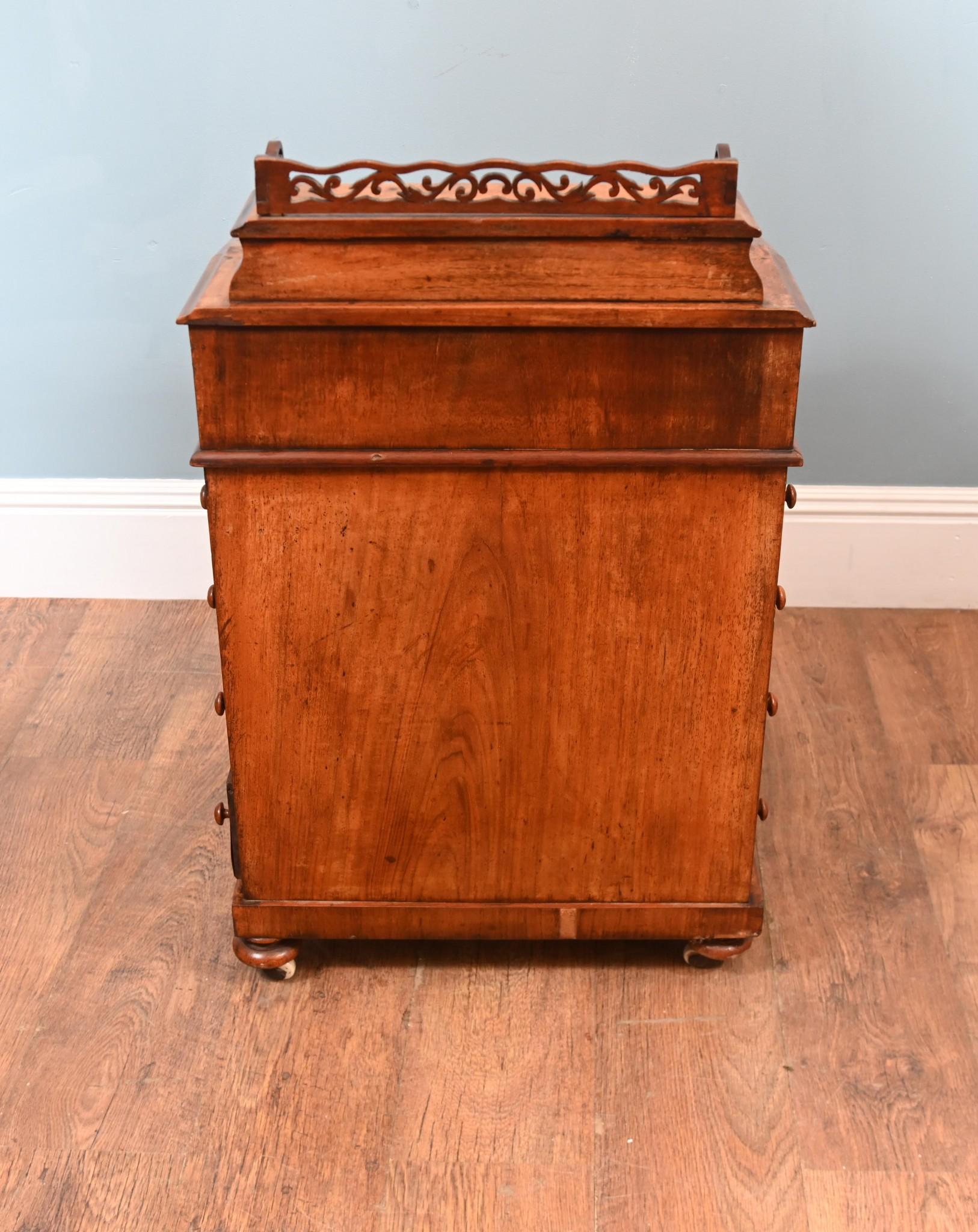 You are viewing a gorgeous Victorian Davenport circa 1860
Burr Walnut with 4 Drawers to the side and a lift up pen holder on top Finished with claret tooled leather acting as a writing surface
One side has all the drawers that open for more