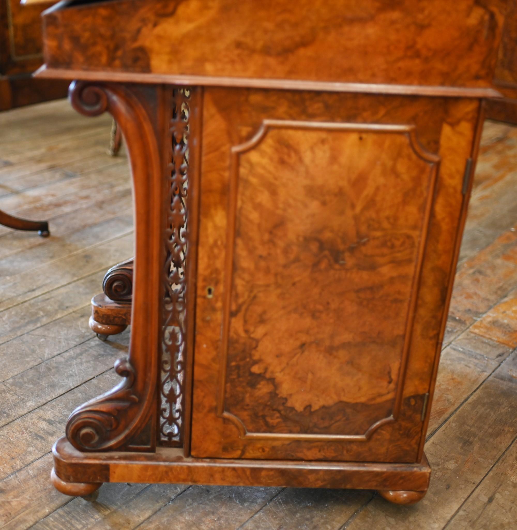 Wonderful period Victorian Davenport desk we date to circa 1880
Crafted from burr walnut with elegant patina
Lovingly restored and refinished red tooled leather writing surface with gilt embossed edges
Large side cabinet opens out to reveal more