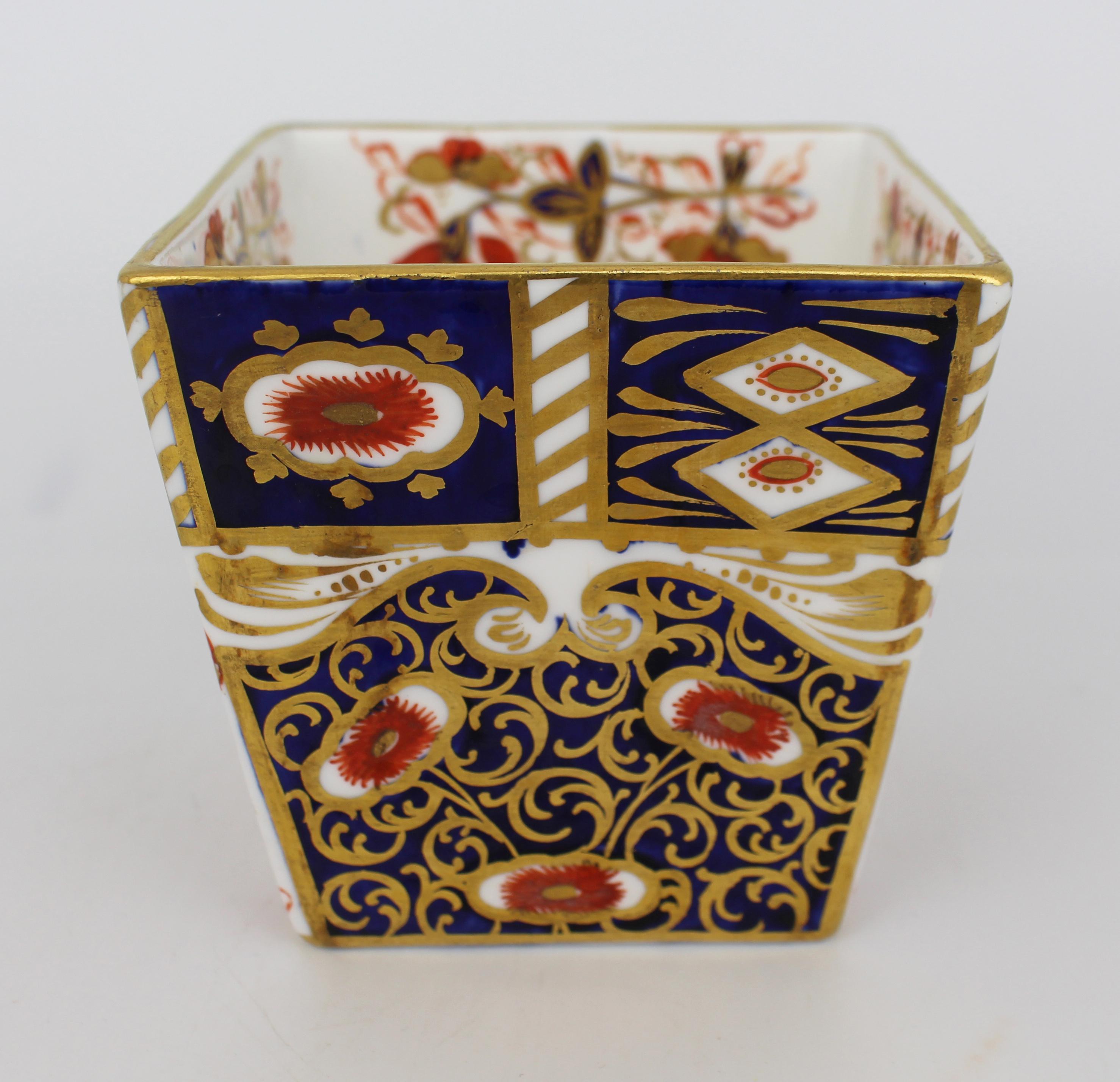 Victorian Davenport Imari Porcelain Tapered Vase, England, circa 1880

A fine quality late 19th century English porcelain vase by Davenport, Longport, Staffordshire. Of square tapering form, this striking piece is decorated in the traditional Imari