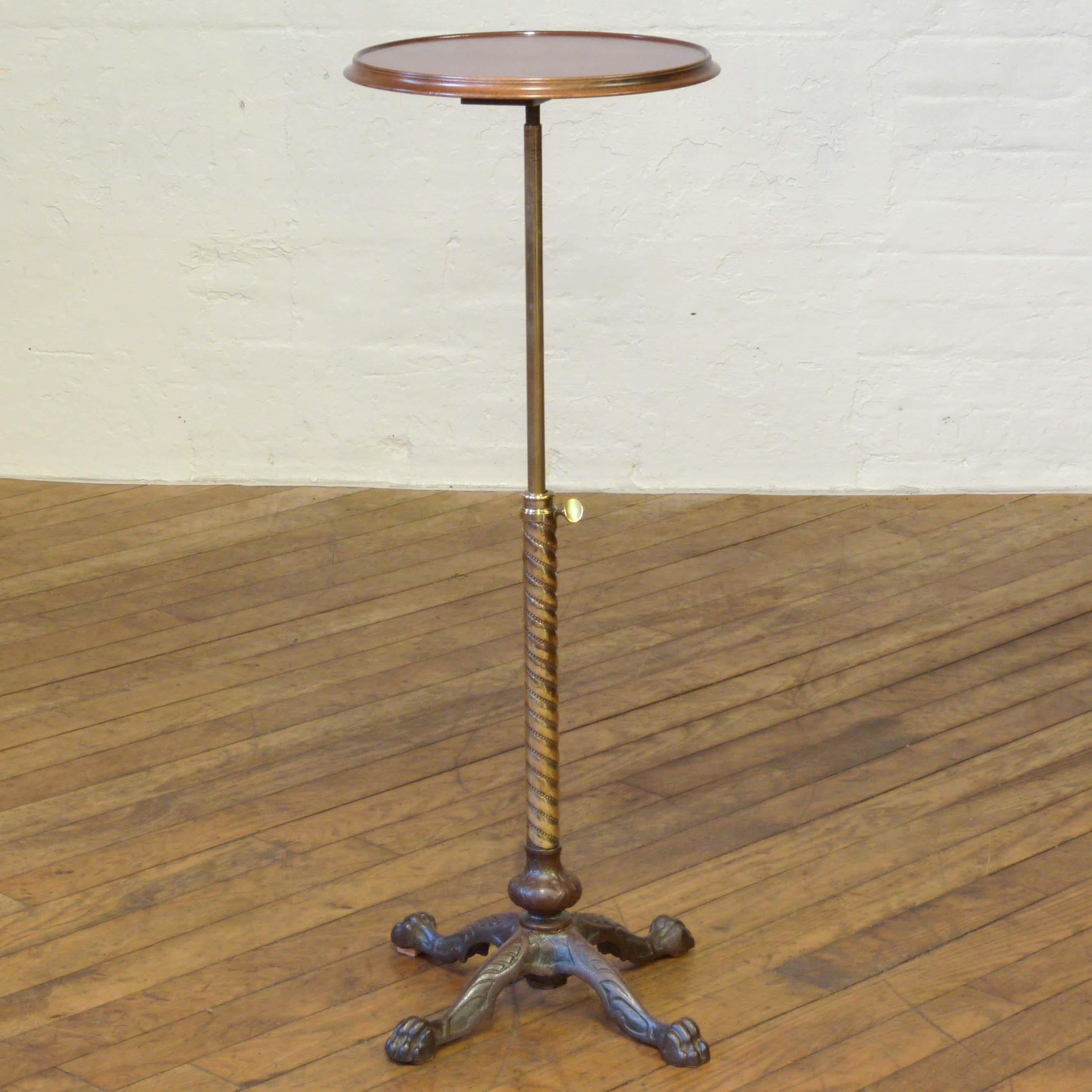 A rare Victorian table originally used by a dentist. The legs are cast iron, which has been stripped and polished, whilst the central column is of brass and is of a wonderful spiral form, with a telescopic adjustment that can double the height. The