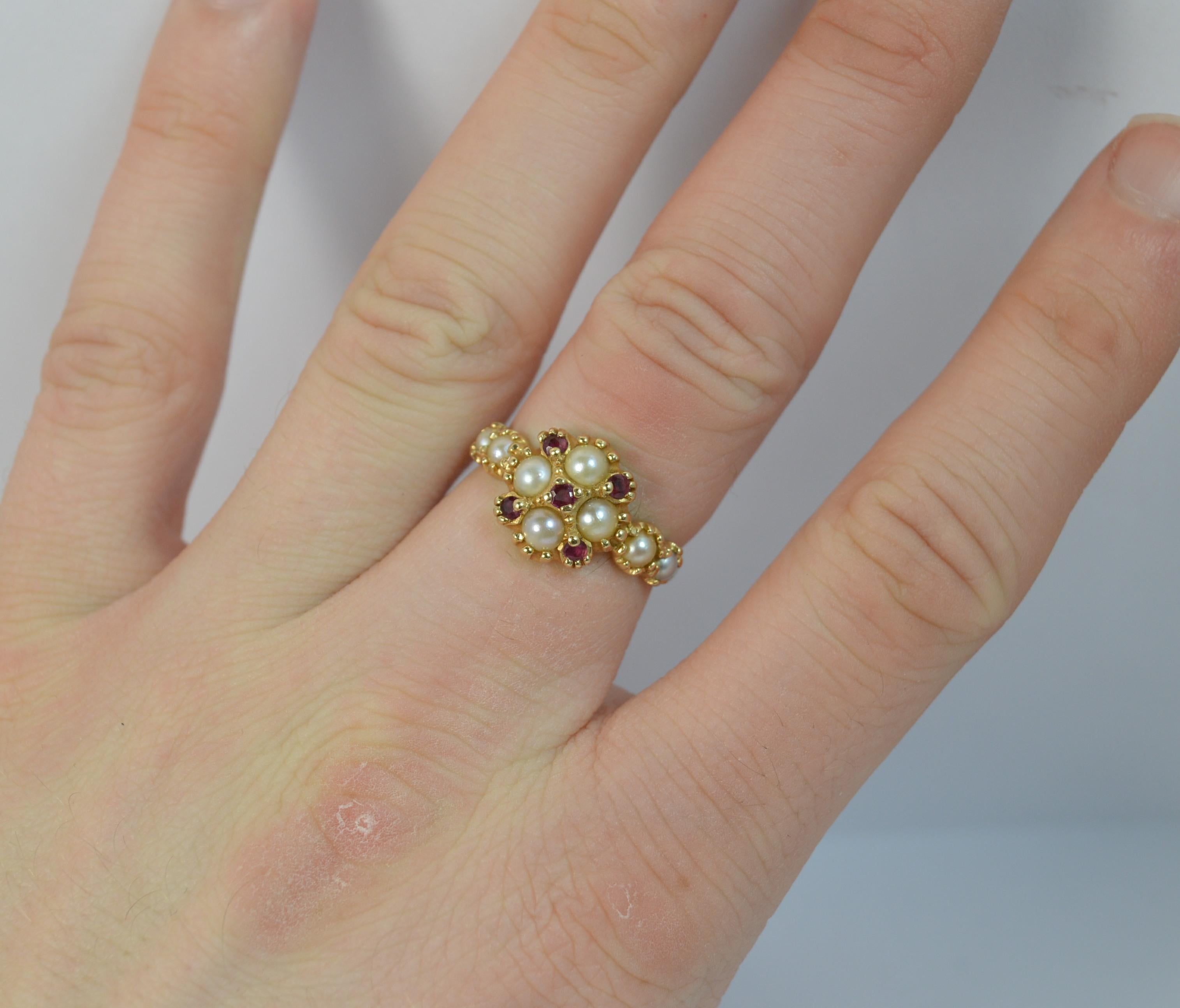 A vintage Victorian design ring.
Size ; N UK, 6 1/4 US
14 carat yellow gold example.

Set with four pearls and five rubies to the head and a further two pearls to each shoulder.

10mm x 11mm head.

Condition ; Excellent. Clean and solid band. Well