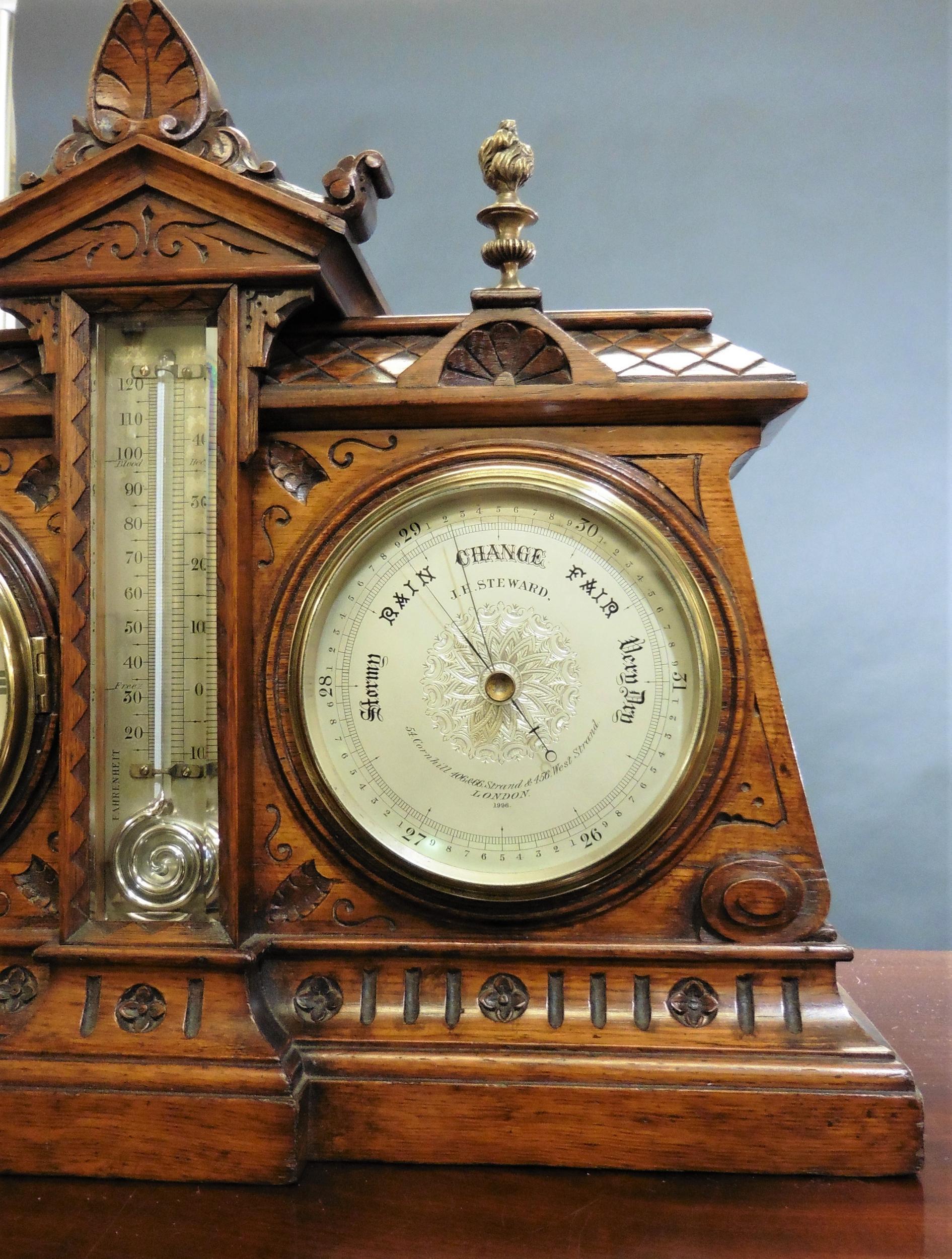Victorian desk clock / barometer set

Gothic style carved oak case standing on a raised, moulded plinth surmounted by two brass flambeau finials and central architectural pediment.

The clock to the left with cast bezel, silvered dial, Roman
