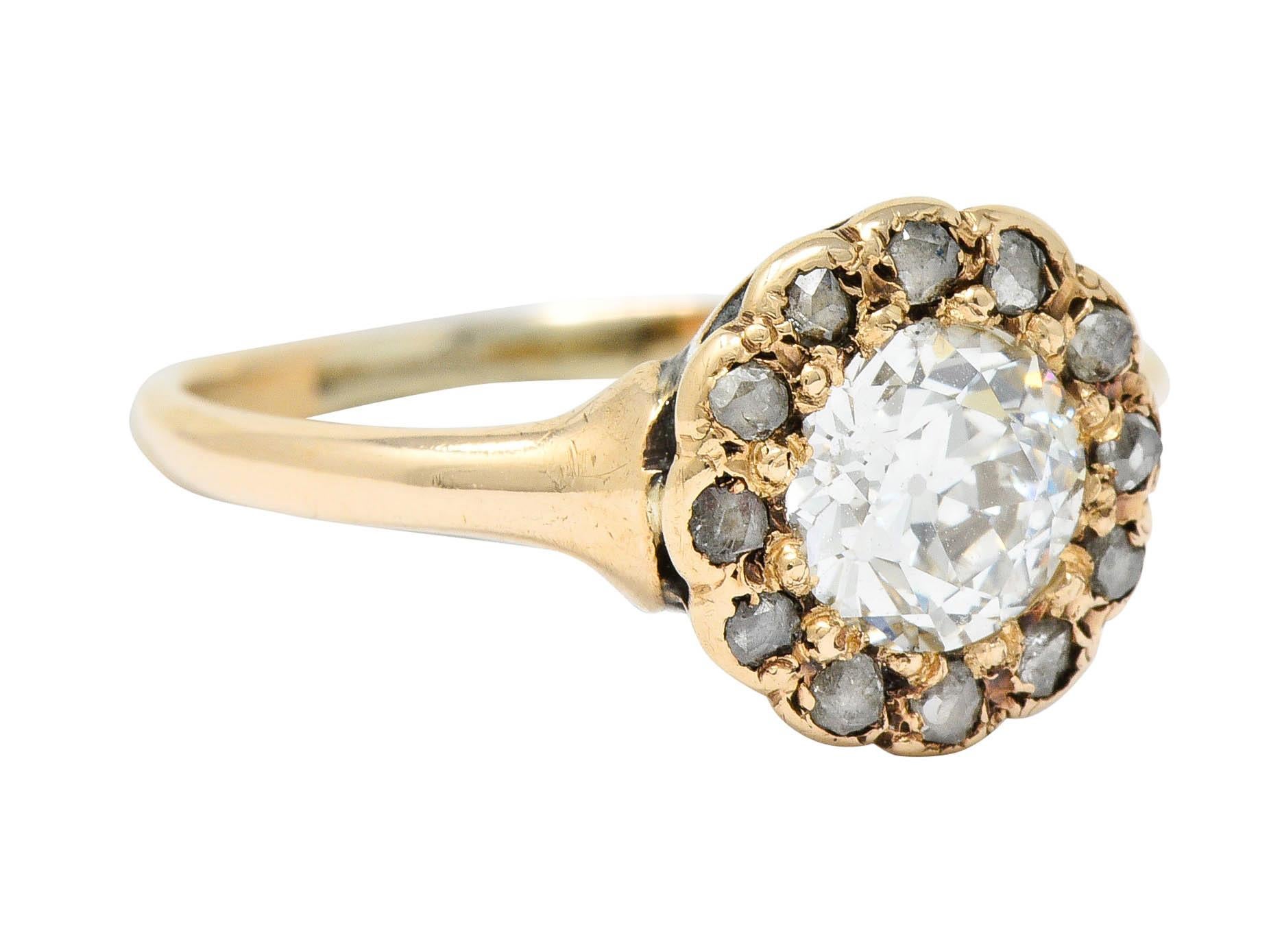 Cluster style ring centers an old European cut diamond weighing approximately 0.65 carat; J color with VS clarity

Surrounded by a halo of rose cut diamonds weighing in total approximately 0.20 carat

Tested as 14 karat gold

Circa: 1900

Ring Size: