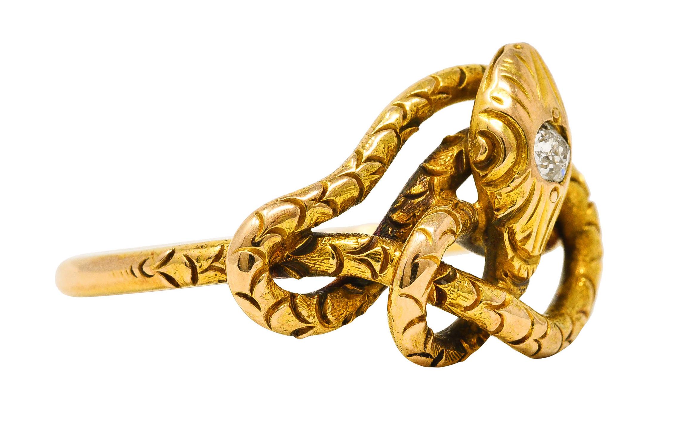 Ring is designed as a coiled snake with engraved scale pattern throughout

Featuring an old mine cut diamond flush set in snake head - eye clean and bright

Stamped 14k for 14 karat gold

Circa: 1880s

Ring size: 7 and sizable

Measures North to