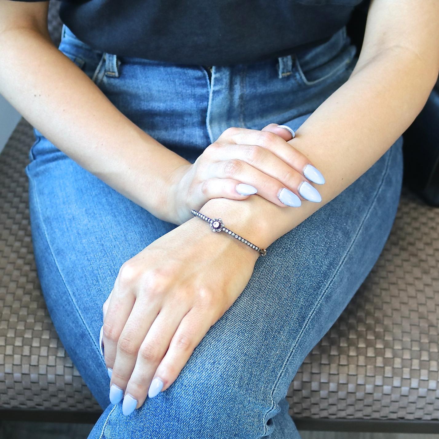 This Victorian diamond bangle will add just the right touch of vintage to your wrist stack. Featuring rose cut diamonds, single cut diamonds, and 1 old European cut diamond in the center of an 18k gold floral setting. The diamonds weigh a total of