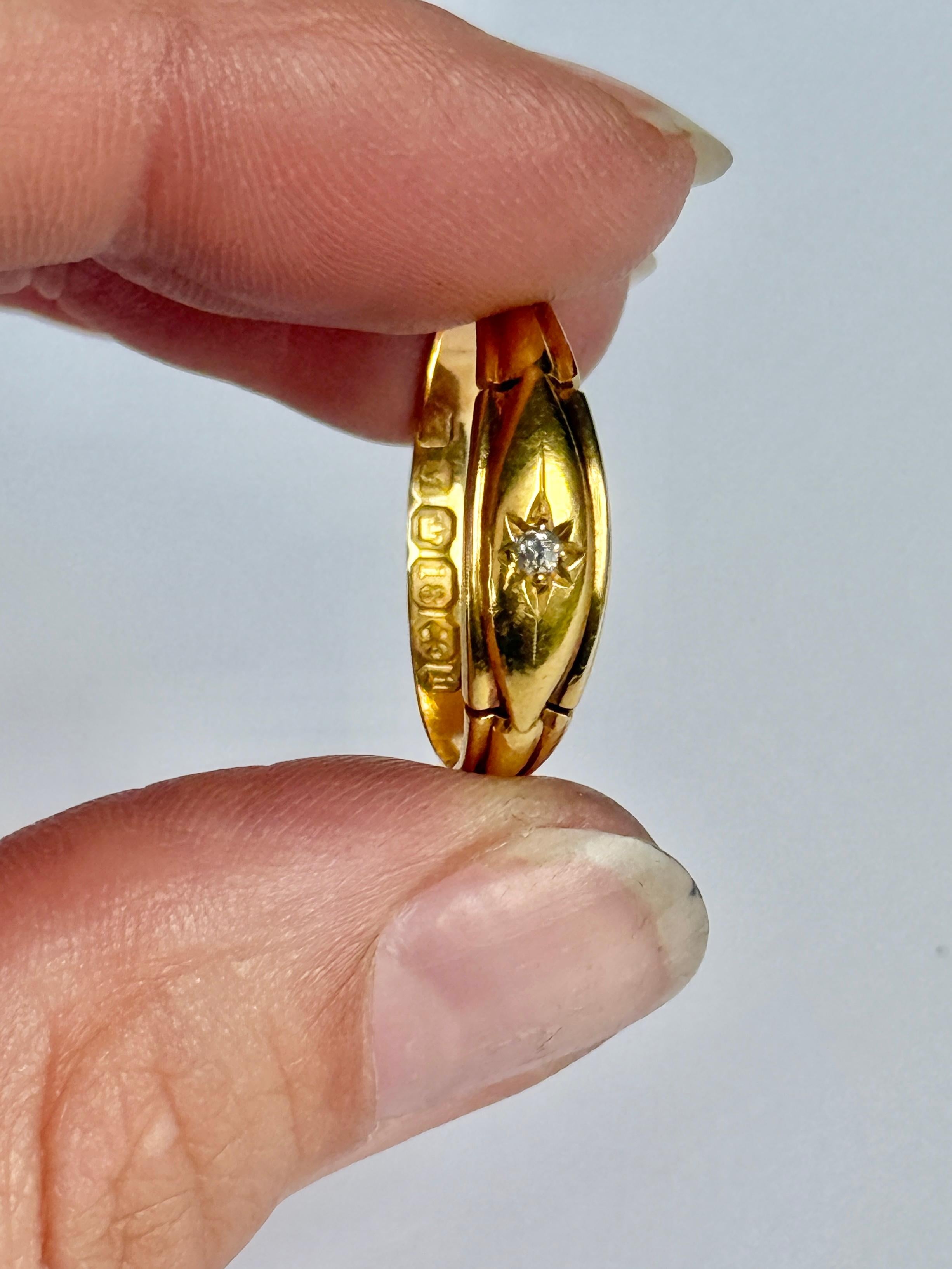 This gorgeous 18ct gold band holds one old mine cut diamond measuring 3pts. It is bright and has a lovely sparkle and set in a star setting. Fully hallmarked Birmingham 1876.

Ring Size: Q or 8 
Band Width: 6mm 
Height Off Finger: 1.5mm

Weight: 2.6g