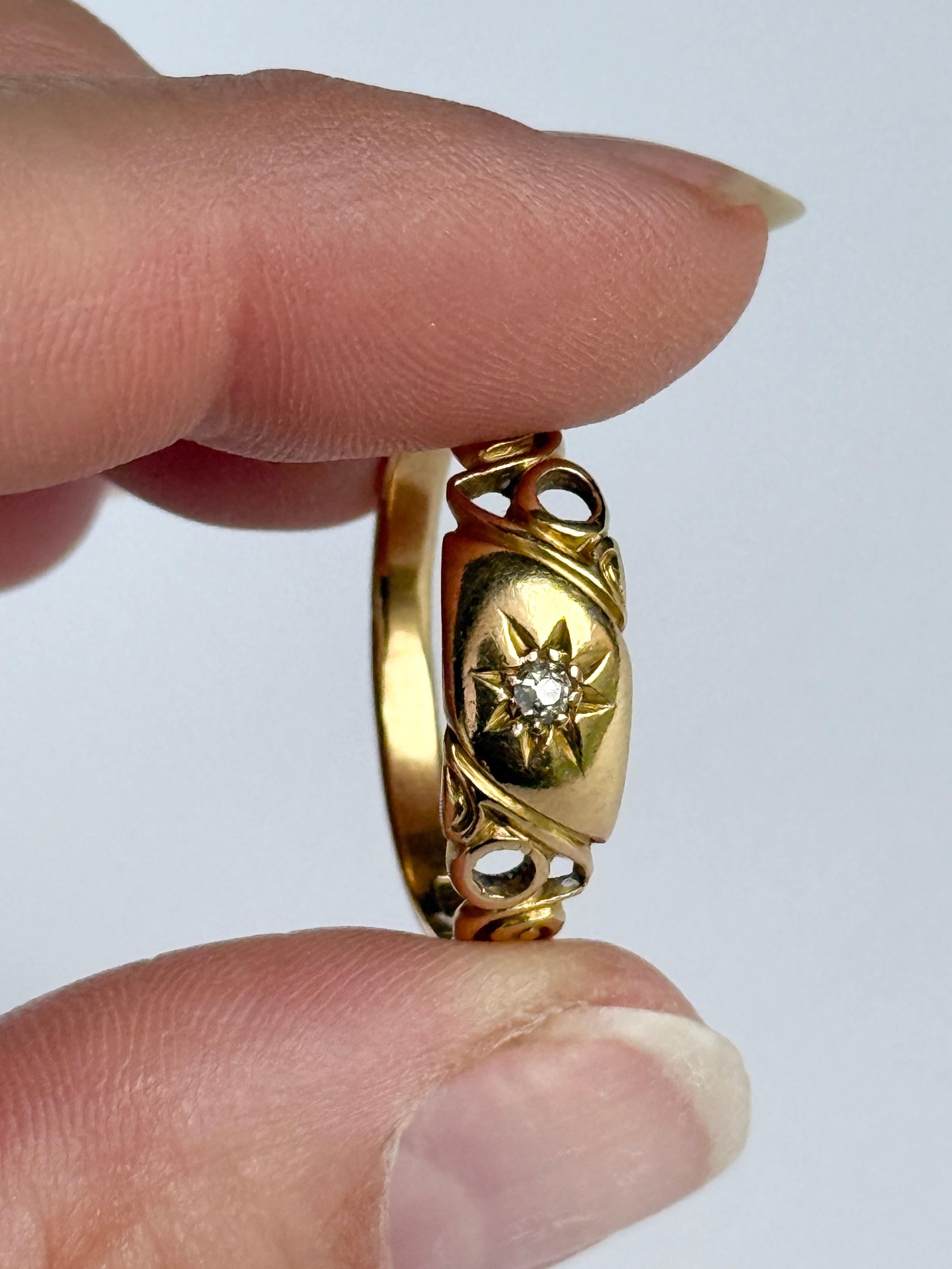 This gorgeous 18ct gold band holds a 5pt diamond. 

Ring Size: T or 9 1/2
Band Width: 6.5mm 
Height Off Finger: 1.5mm

Weight: 3.4g