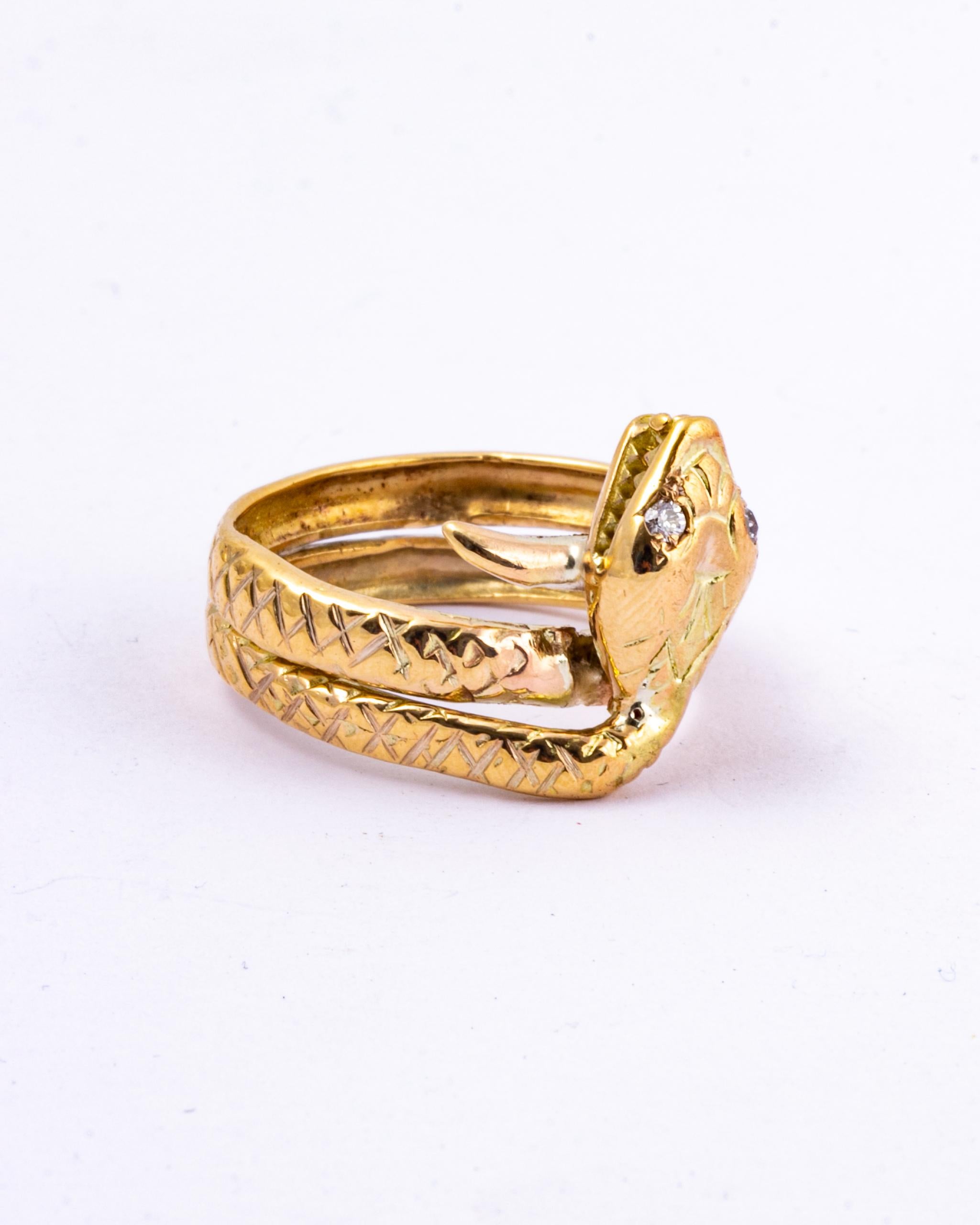 The stunning snake design of this ring is fantastic and has so much detail. It coils around the finger with a textured tail and diamond set eyes. The diamonds measure approx 5pts each and are bright and sparkly. 

Ring Size: Q or 8 
Widest Point: