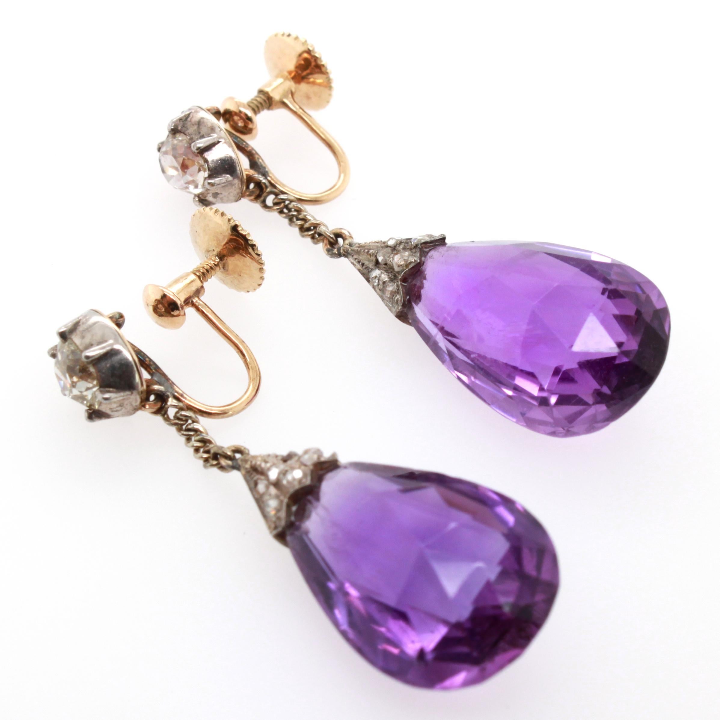 Fine antique early Victorian Siberian amethyst earrings with additional diamonds from mid 19th century.
The amethyst have an intense violet color with red flashes and are cut in a beautiful old briolette shape set with additional rose and old cut