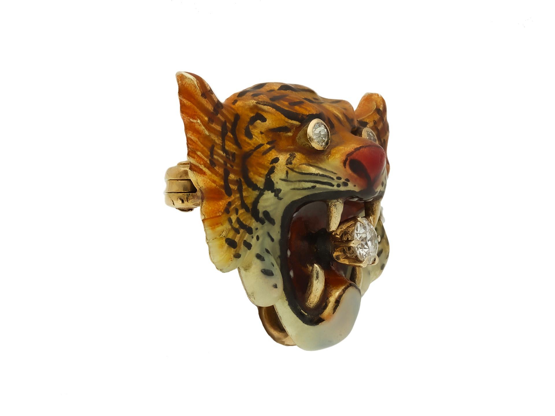 Victorian diamond and enamel tiger brooch. Set to centre with a round old cut diamond in a closed back claw setting, with an approximate weight of 0.20 carats, further set with two round old cut diamonds in closed back rubover settings with an