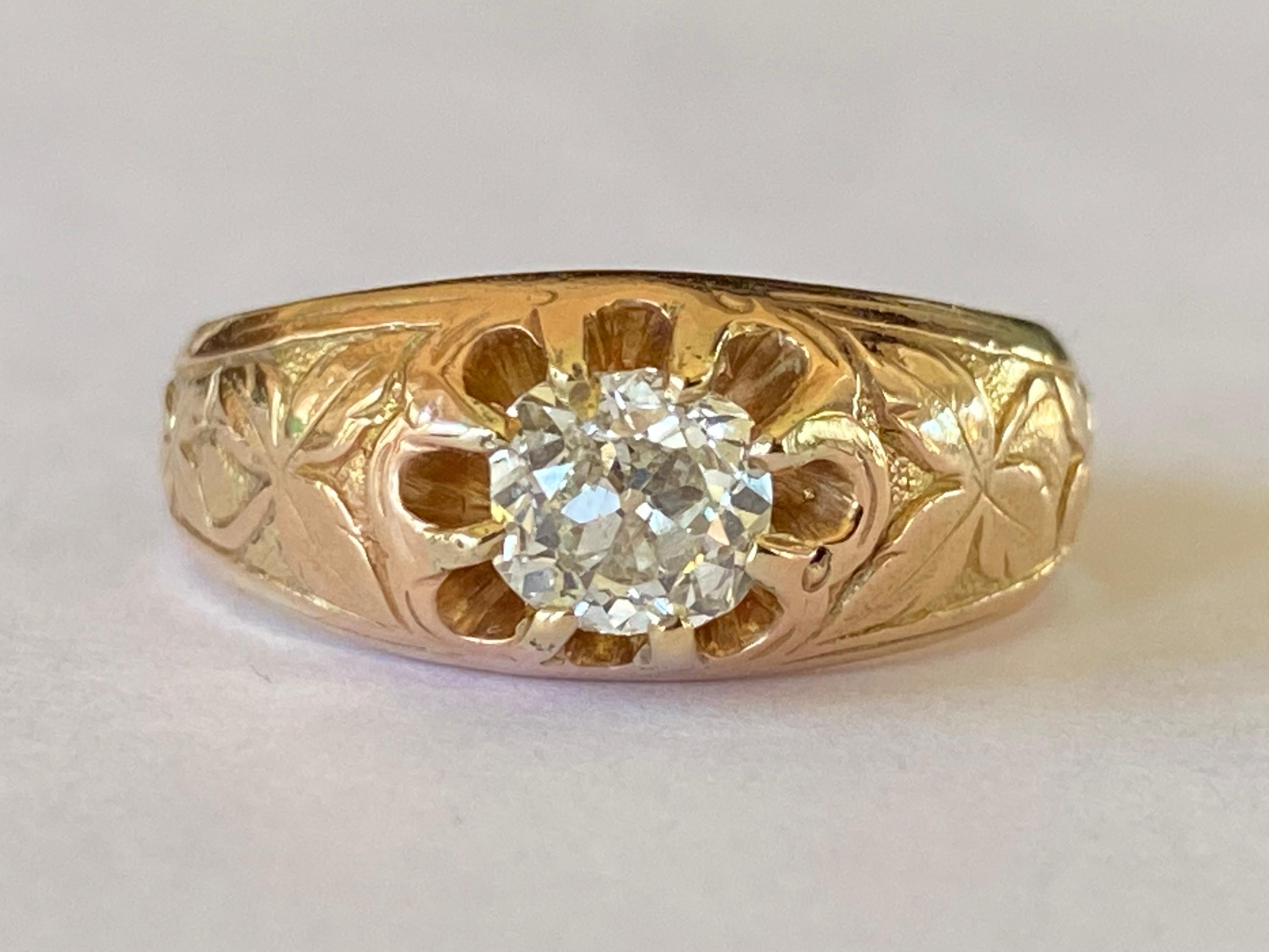 This exquisite Victorian ring handcrafted in the late nineteenth century in 14kt yellow and rose gold features a natural Old Mine cut center stone measuring 5.54 x 5.74 x 3.81mm and approximately 0.90 carats, I-J color, SI2 clarity mounted in a