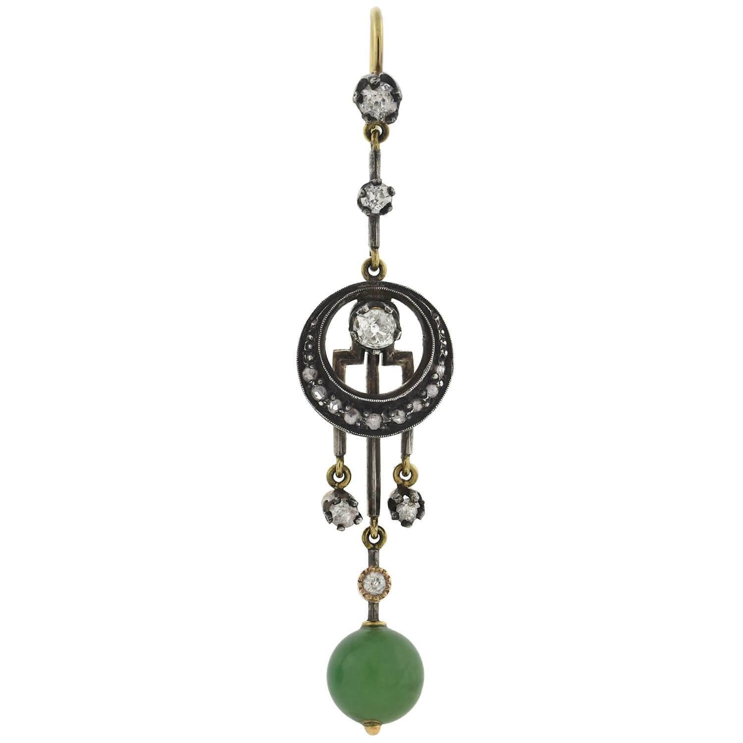 A gorgeous pair of jade and diamond earrings from the Victorian (1880s) era! Crafted in 14kt yellow gold and sterling silver, these dramatic earrings feature approximately 1.30ctw of old Mine and Rose Cut diamonds set within a unique setting. The
