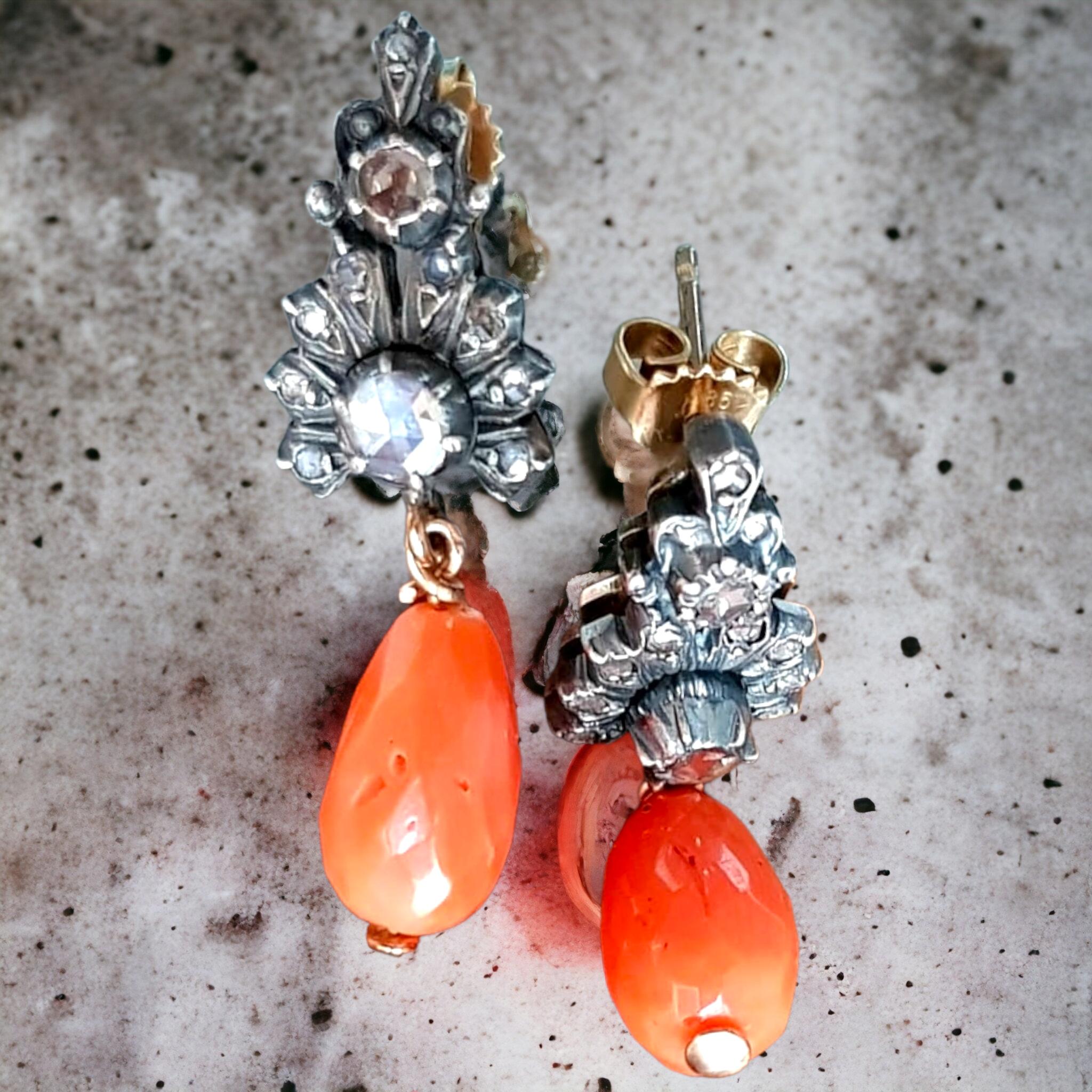 Antique Victorian Mediterranean Salmon Pink Coral and Rose Cut Diamond Ear Pendants.
These bright and cheerful 40mm, 1 1/2 inch long antique earrings feature a matched pair of luscious, deep salmon color coral drops, capped in silver and rose-cut