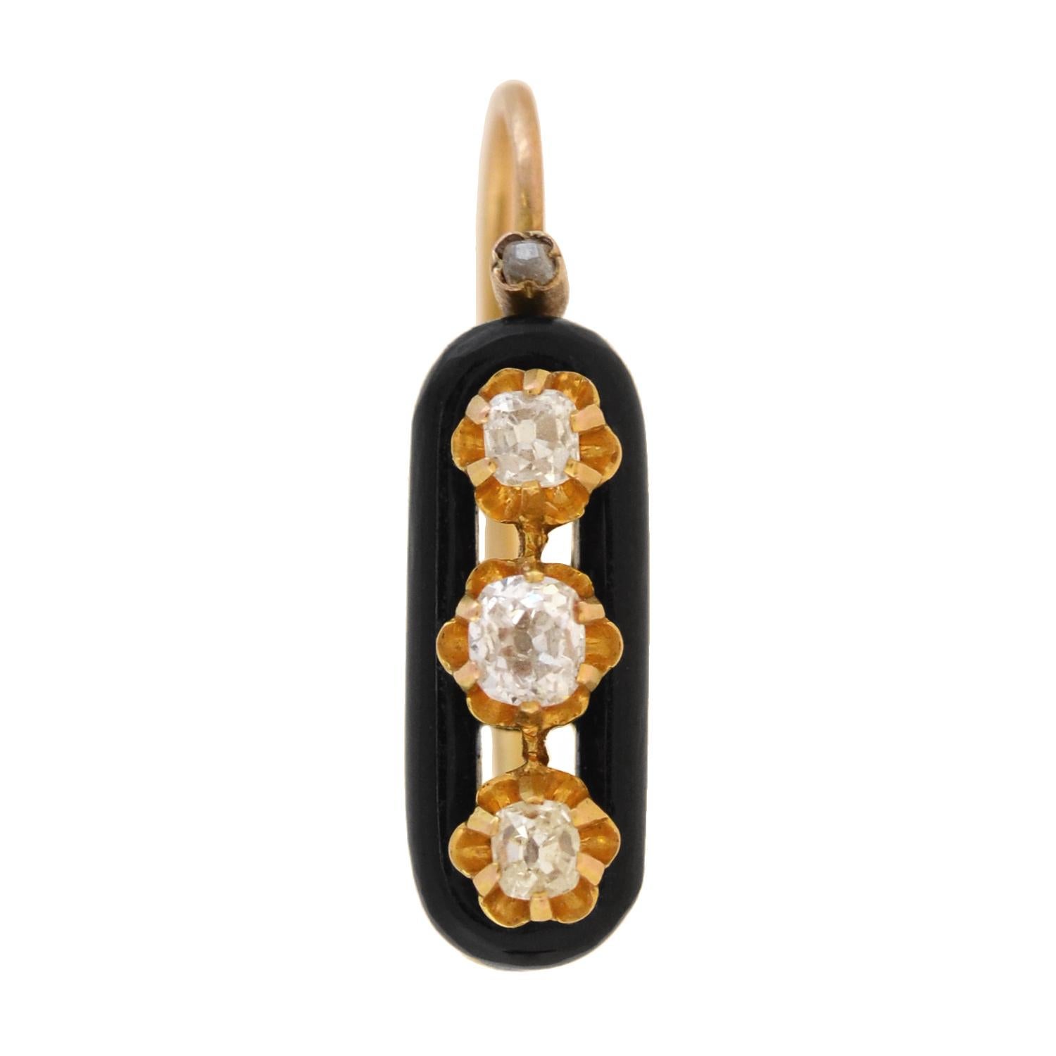 A lovely pair of diamond and onyx earrings from the Victorian (ca1880) era! Crafted in 15kt rosy yellow gold, each earring adorns three sparkling old Mine Cut diamonds that form a simple, yet beautiful design. The stones line the center of an onyx