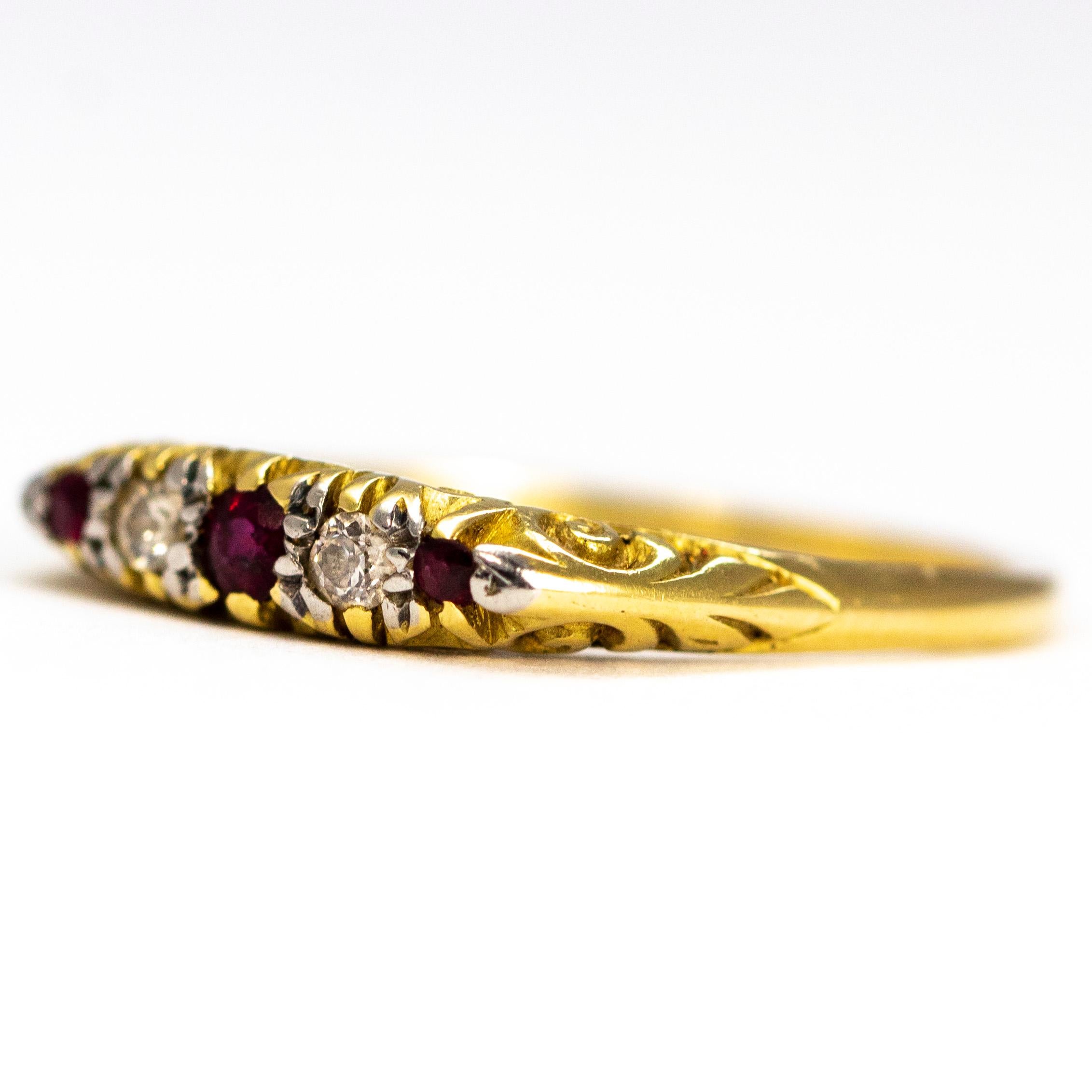 This gorgeous and delicate ring holds five stones. The centre ruby measures 7pts and the two smaller rubies measure 3pts. The stones are set in platinum and the rest of the ring is modelled in 18ct gold. 

Ring Size: O 1/2 or 7 1/2
Band Width: 3.6mm