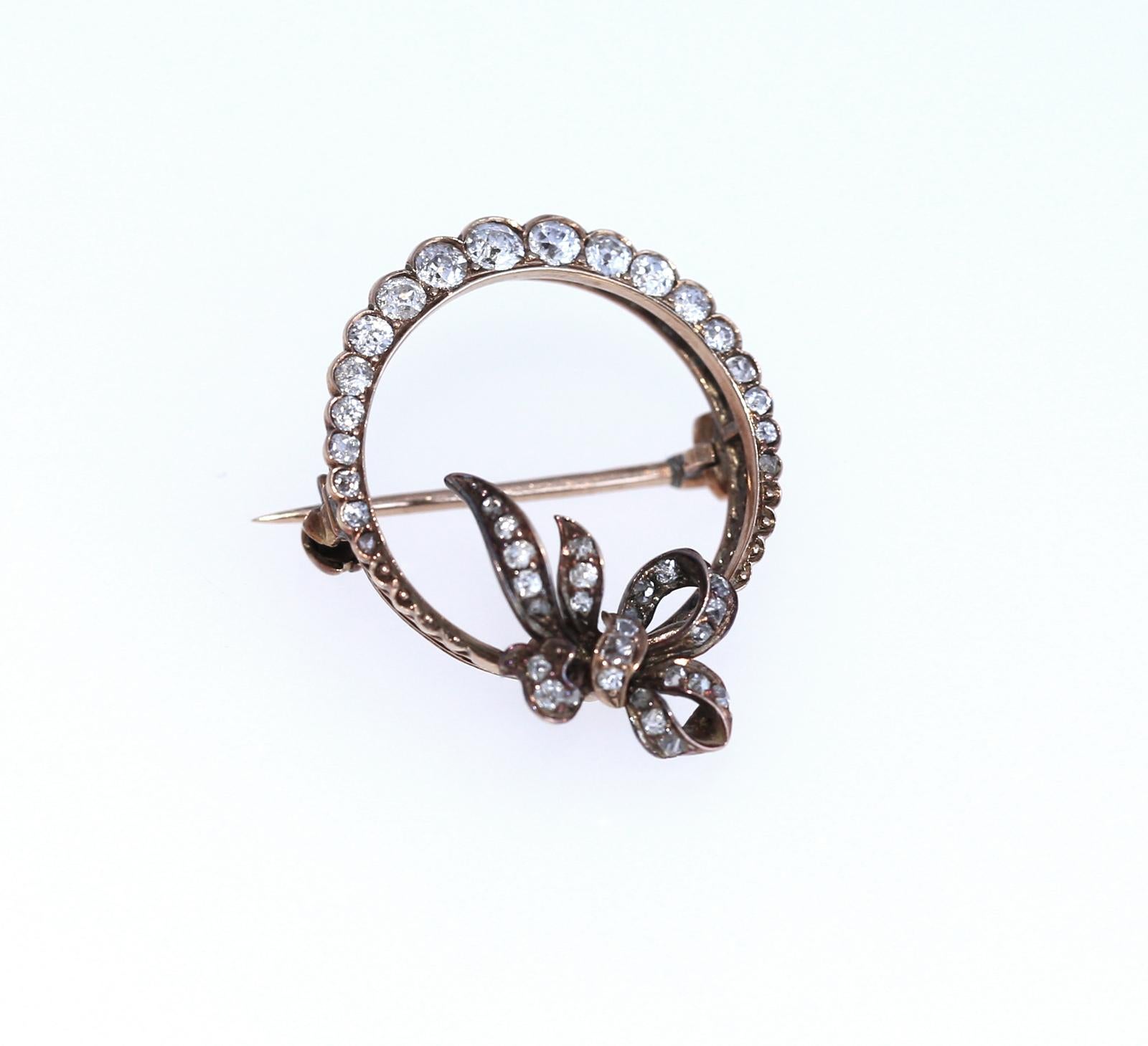 Fine Diamond brooch of Victorian era. Containing 45 Old mine and mixed cut Diamonds. Mounted in rose gold.
Pin back stamp: 585 (partially obscured mark).
The brooch measures approximately 1 1/8 inches by 7/8 inch. 18K Gold with 14K  frame and pin
