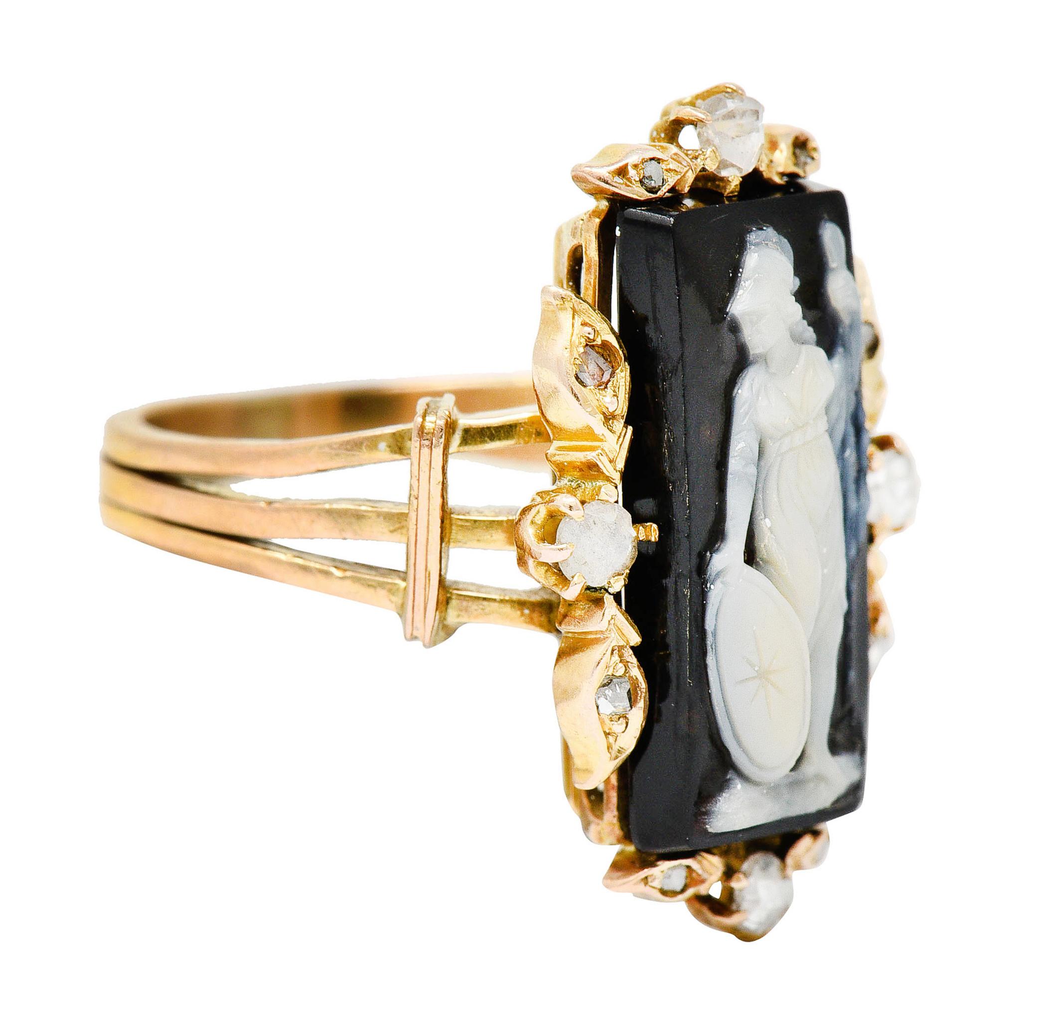 Centering a rectangular tablet of onyx agate deeply carved to depict the goddess Athena

Figure is translucently cream in color and features her iconic star emblazoned shield

With gold foliate stations at each cardinal point - accented by rose cut