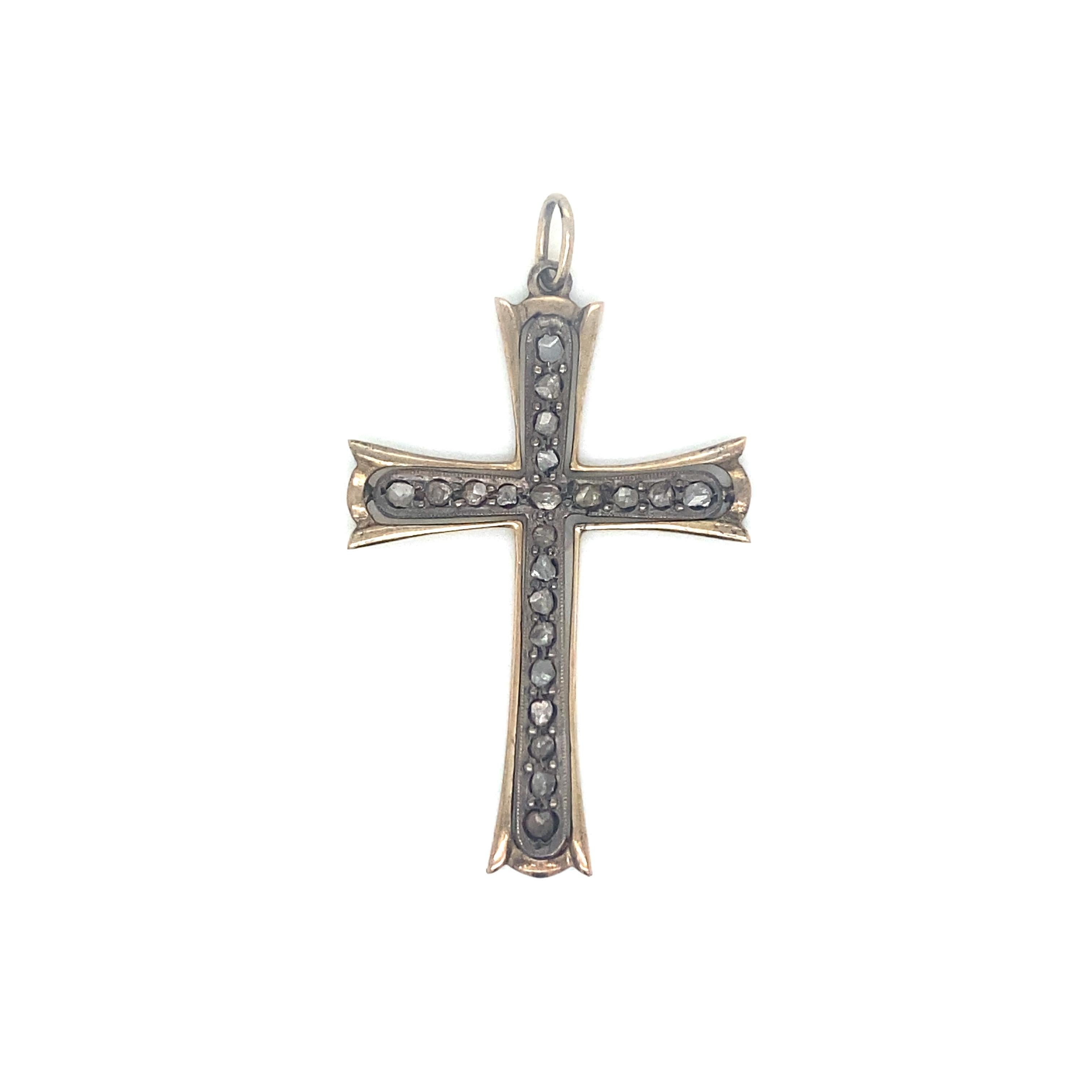 An Antique 12k yellow Gold and silver Cross, it features 24 Rose-cut Diamond, total weight 0,25 carat, beautifully set in shiny prong settings.
circa 1890 in Excellent condition

Measures: long 1,69 inches (4,3 cm) x wide 1,18 in (3 cm) 
Gross