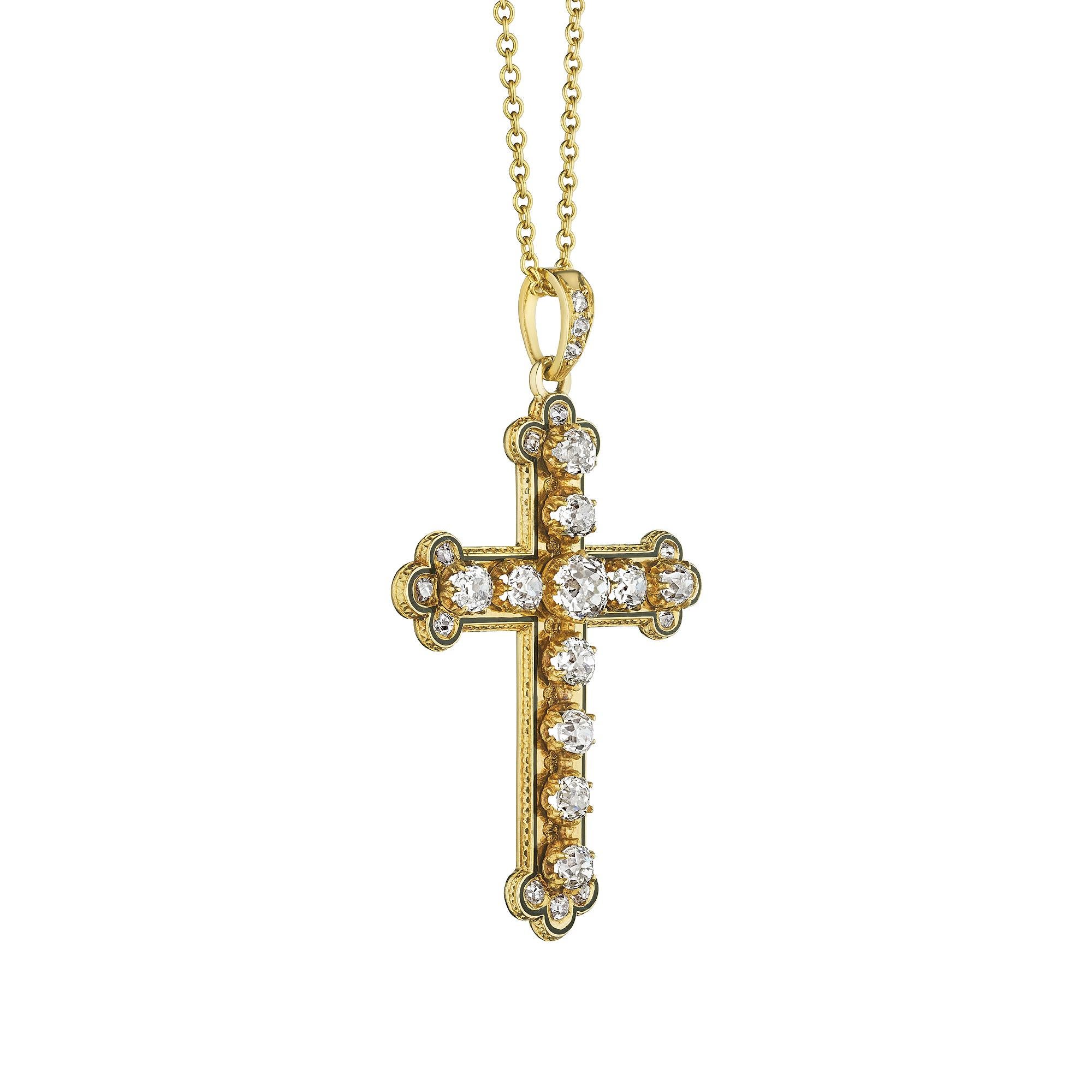 Beautifully lit up with 11 large cushion cut diamonds and 12 side diamonds, this Victorian handmade black enamel and 18 karat yellow gold cross is one-of-a-kind.  Circa 1870.  Total diamond weight is approximately 2.00 carats.  1 9/10