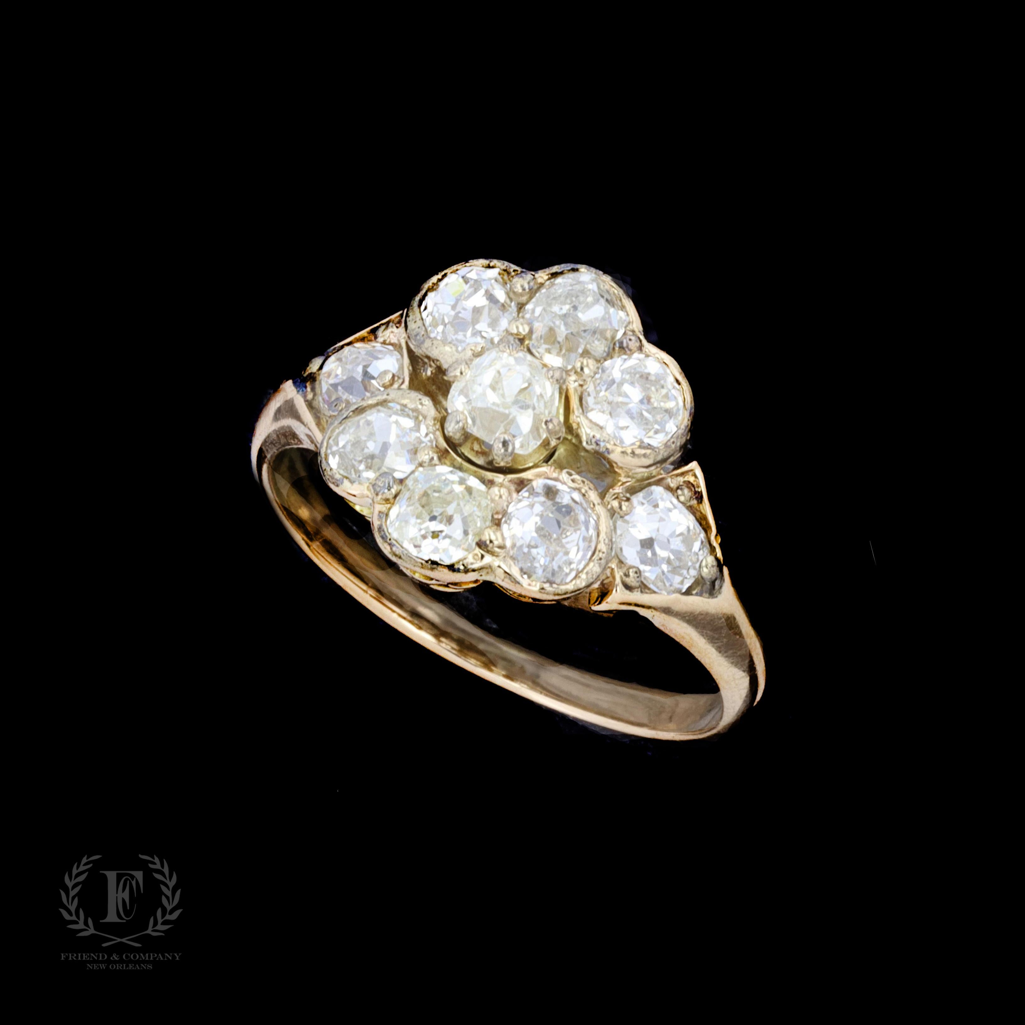 A lovely Victorian flower ring set with old mine cut diamonds that weigh approximately 1.50 carats. The color of the diamonds is J-K with VS2-SI clarity. The ring is stamped 14K and weighs 4.8 grams. The ring is a size 7 1/4, but it can be re-sized.