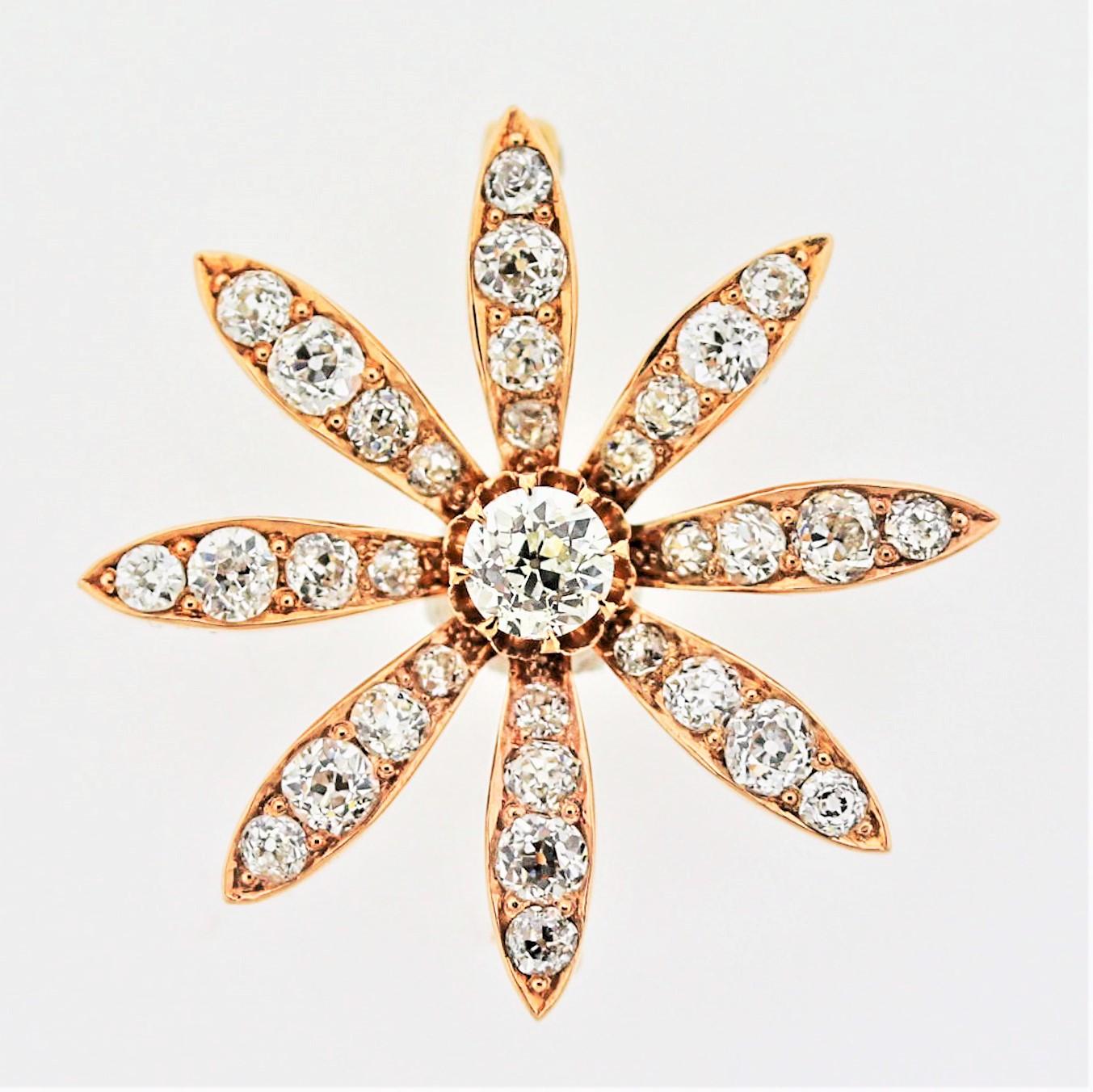 A lovely antique from the Victorian era, circa 1890, with all the classic Victorian features. The diamonds are bright white chunky old European-cut diamonds which weigh a total of approximately 3 carats. The center diamond is about half-a-carat and