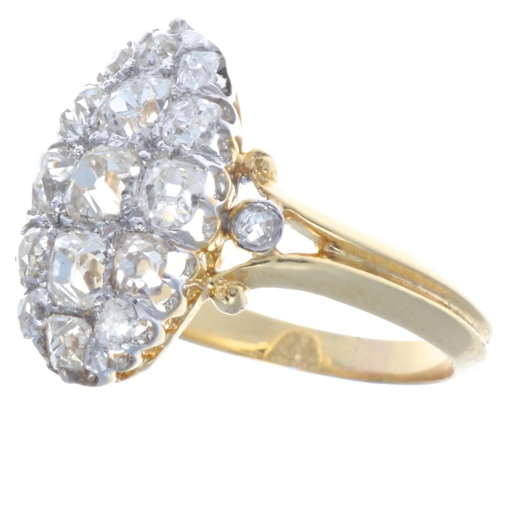 Sweetly stunning Victorian diamond ring featuring 17 old mine cut diamonds weighing approximately 1 carat,  I-J color, VS-SI clarity. In 14k gold. Circa 1900. Ring size 5 1/2 and may be re-sized to fit. 