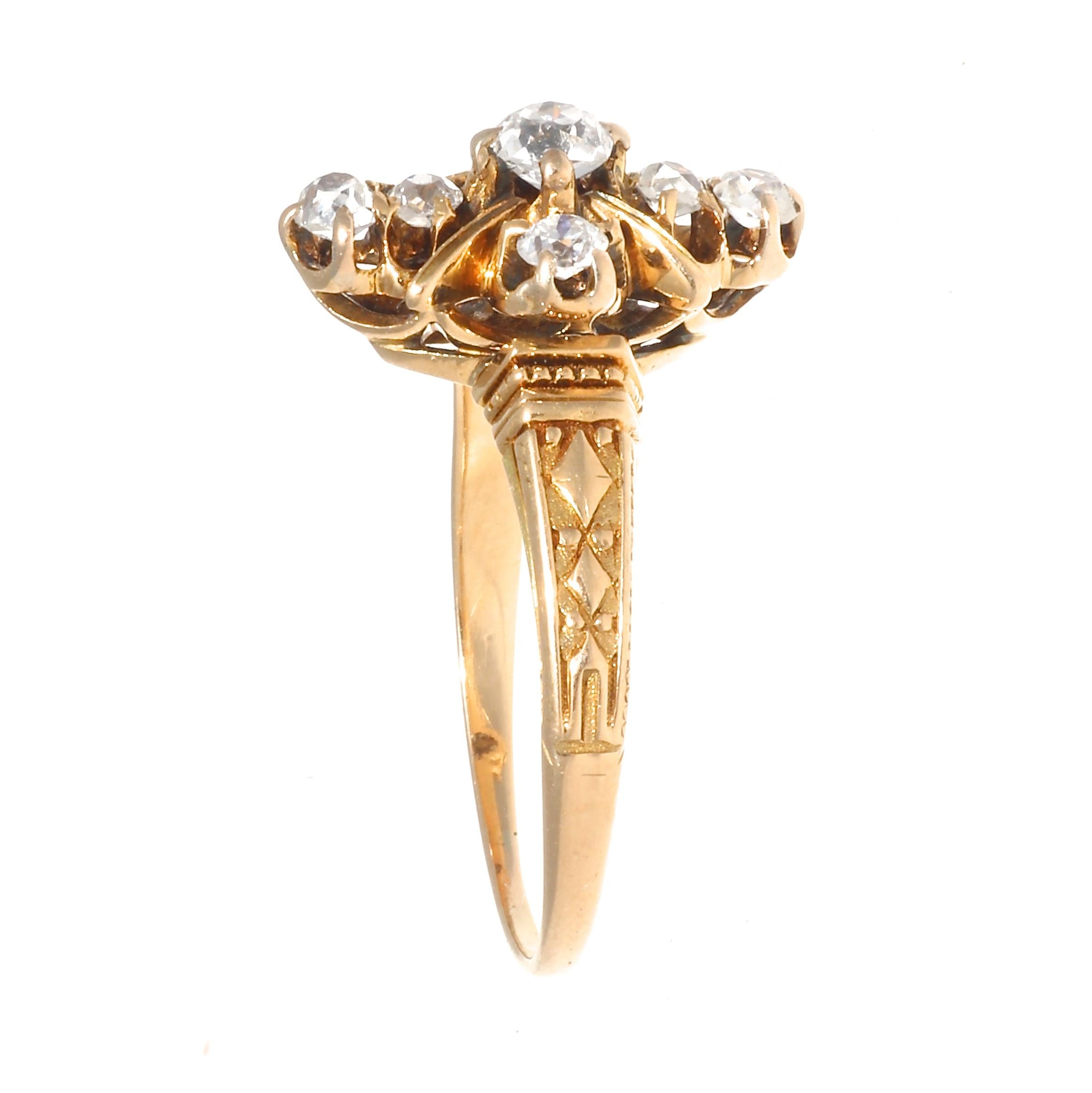 Beautiful Victorian diamond 14k yellow gold ring. Featuring 7 old mine cut diamonds that weigh approximately 0.40 carats, graded G-I color, all VS clarity except one, which is Si clarity. Circa 1800s. Ring size 6 and comes with complimentary sizing