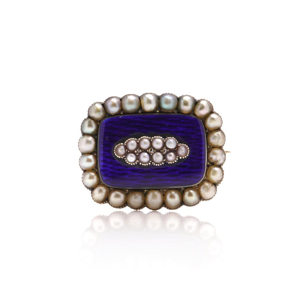 Victorian Diamond, Pearl, and Blue Enamel Mourning Brooch crafted in 9kt gold. 

This Victorian mourning brooch features a central cluster of pearls and three single-pointed diamonds set on a blue enamel background, and all mounted in gold. The