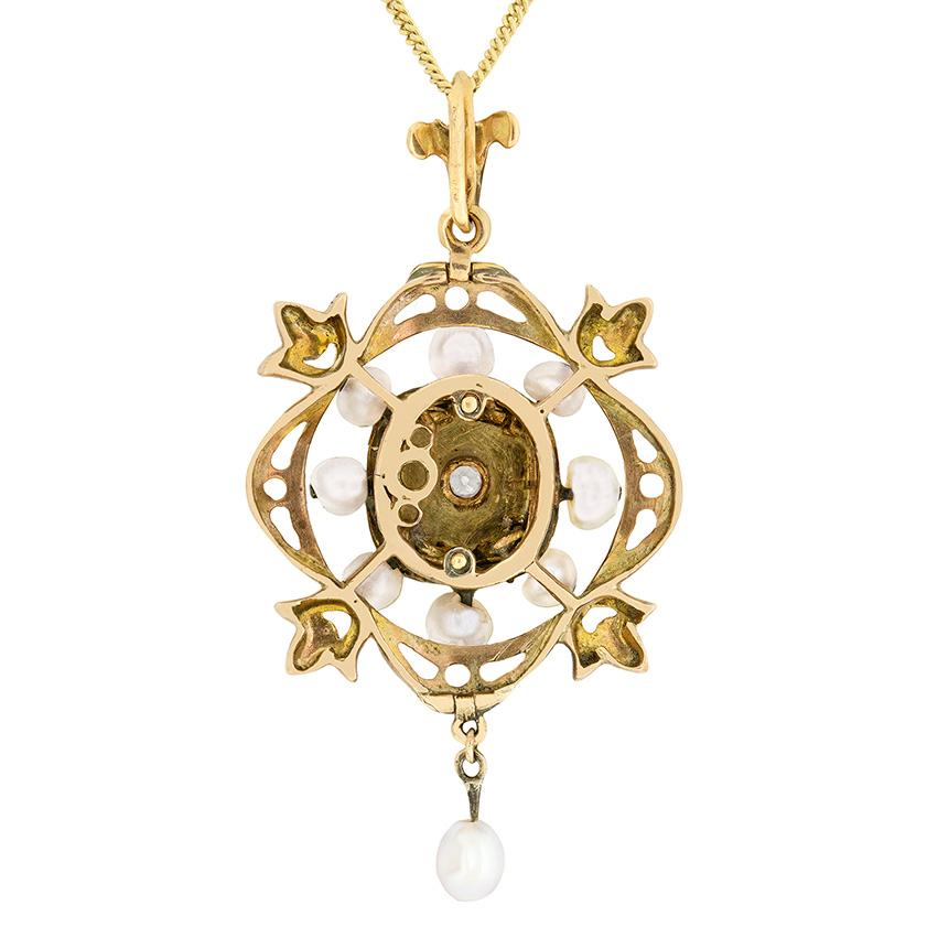 Dating to the 1890s, this Victorian pendant and brooch is a stunning piece of jewellery. The design centres an old cut diamond weighing 0.10 carat, within a rub over setting. Surrounding is beautiful, hand crafted, enamel. The remainder of the piece