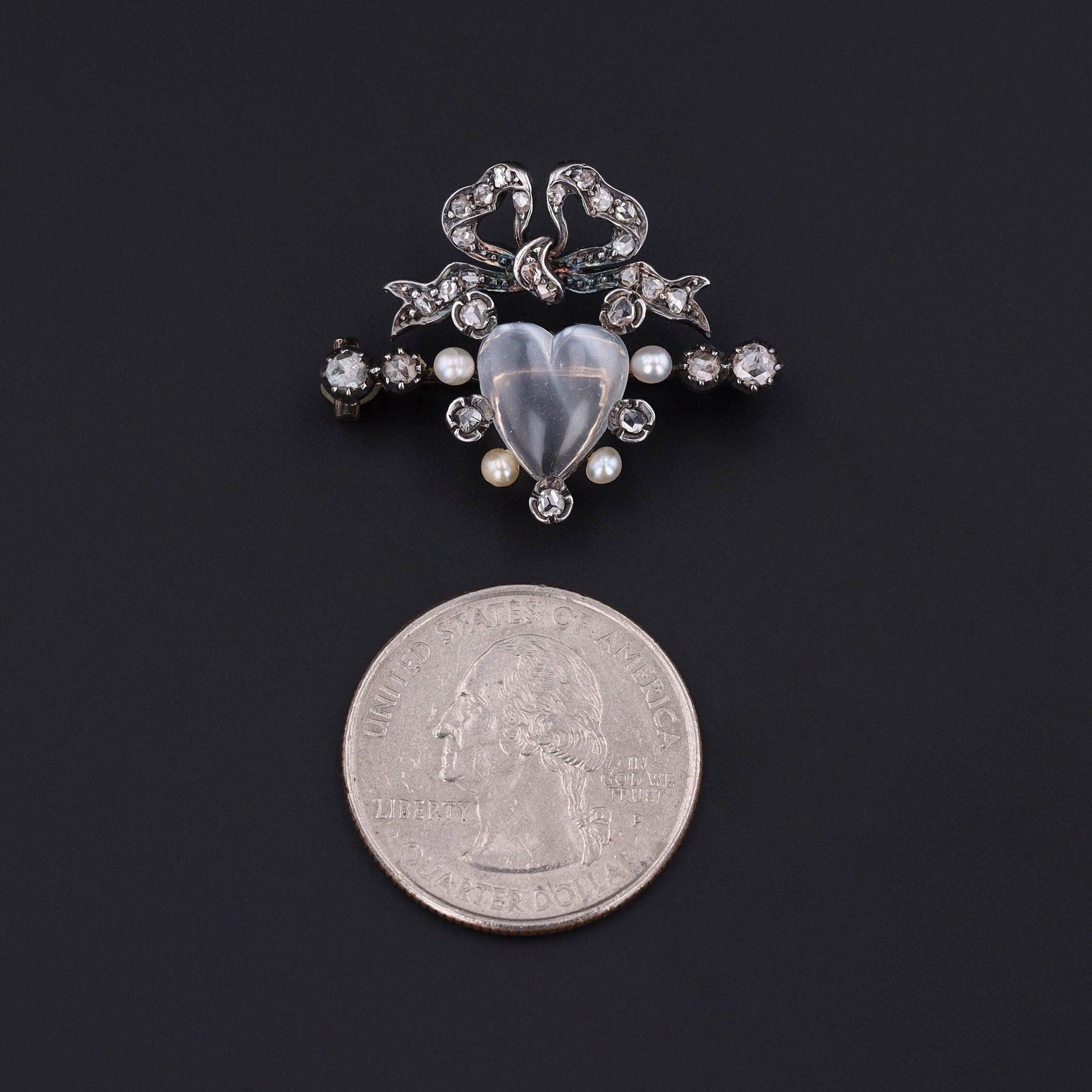 You’ll fall in love with this moonstone brooch!

This antique brooch dates to the late Victorian era (circa 1880-1900). It is silver topped 14k gold with a heart shaped moonstone surrounded by glittery diamonds and pearls. 

The piece measures 1
