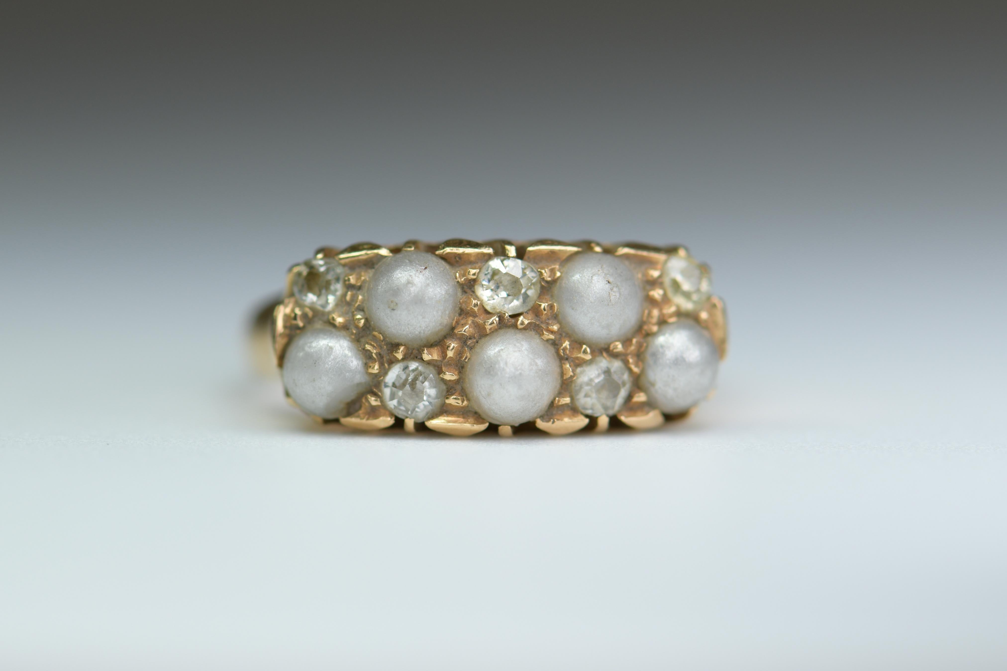 Modeled in 18ct gold this Victorian ring is in wonderful condition given its age.  The ring is with five pearls and five diamonds to the head, the pearl has a wonderful luster with a rich creamy tone. 

It is currently a size N (UK), 6 2/3 (US), and