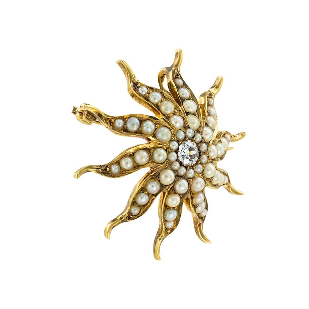 Victorian diamond pearl and yellow gold starburst brooch pendant circa 1890. 

SPECIFICATIONS:

DIAMOND:  one round diamond weighing approximately 0.20 carat, approximately VS clarity.

PEARLS:   graduating round pearls.

METAL:  14-karat yellow