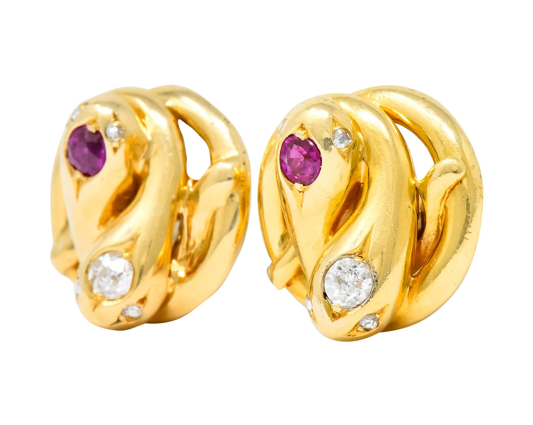 Victorian earrings converted to studs and designed as two intertwined snakes accented by rose cut diamond eyes

One snake on each earring is bead set with a round cut ruby weighing approximately 0.26 carat total, transparent and violetish-red in