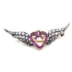 Victorian Diamond Ruby and Pearl Silver and Yellow Gold Winged Heart Brooch