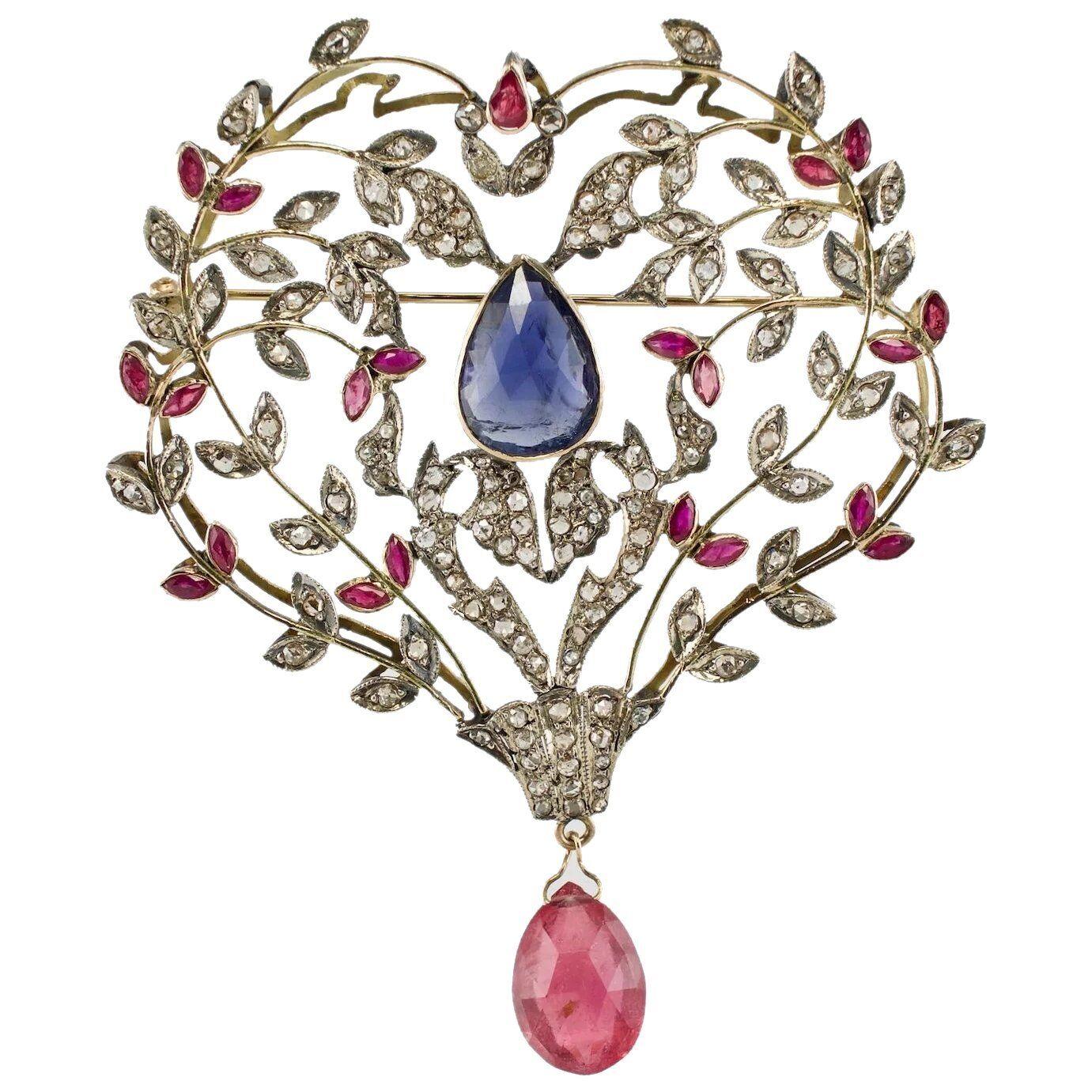 Victorian Diamond Ruby Sapphire Pendant Brooch 14K Gold & Silver

This highly collectible and one of a kind piece is finely crafted in solid 14K Yellow Gold and Sterling Silver for the top. All gems are original for the setting. The center genuine