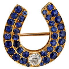 Victorian diamond sapphire 18k yellow gold horseshoe brooch