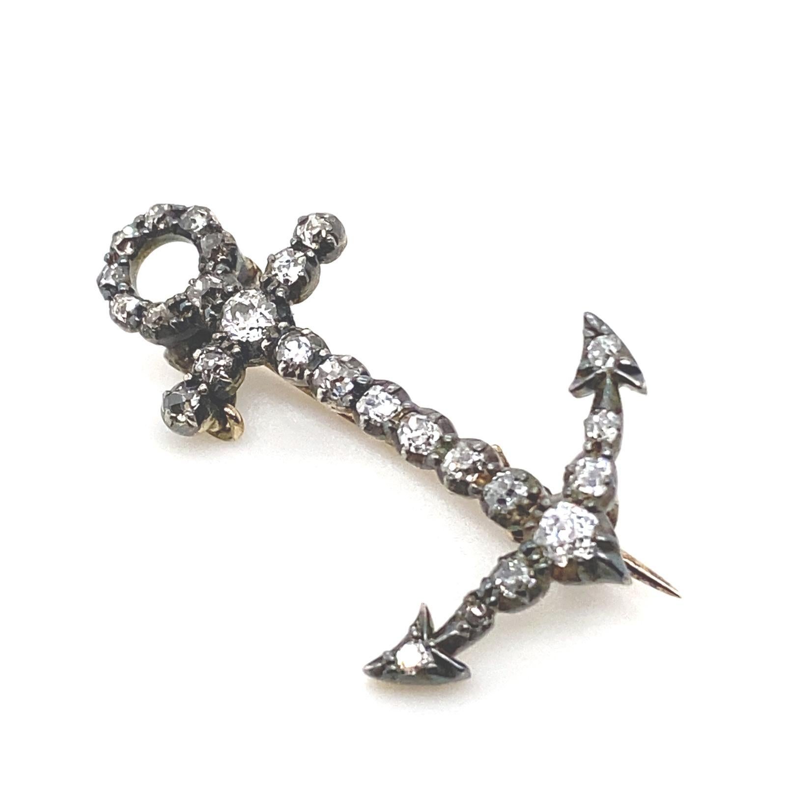 A Victorian diamond set anchor brooch in silver and yellow gold.

This late 19th Century brooch, takes the form of an anchor, set throughout with old mine cut diamonds for a total of 0.50 carats approximately, assessed as H-L colour, VS2 clarity all
