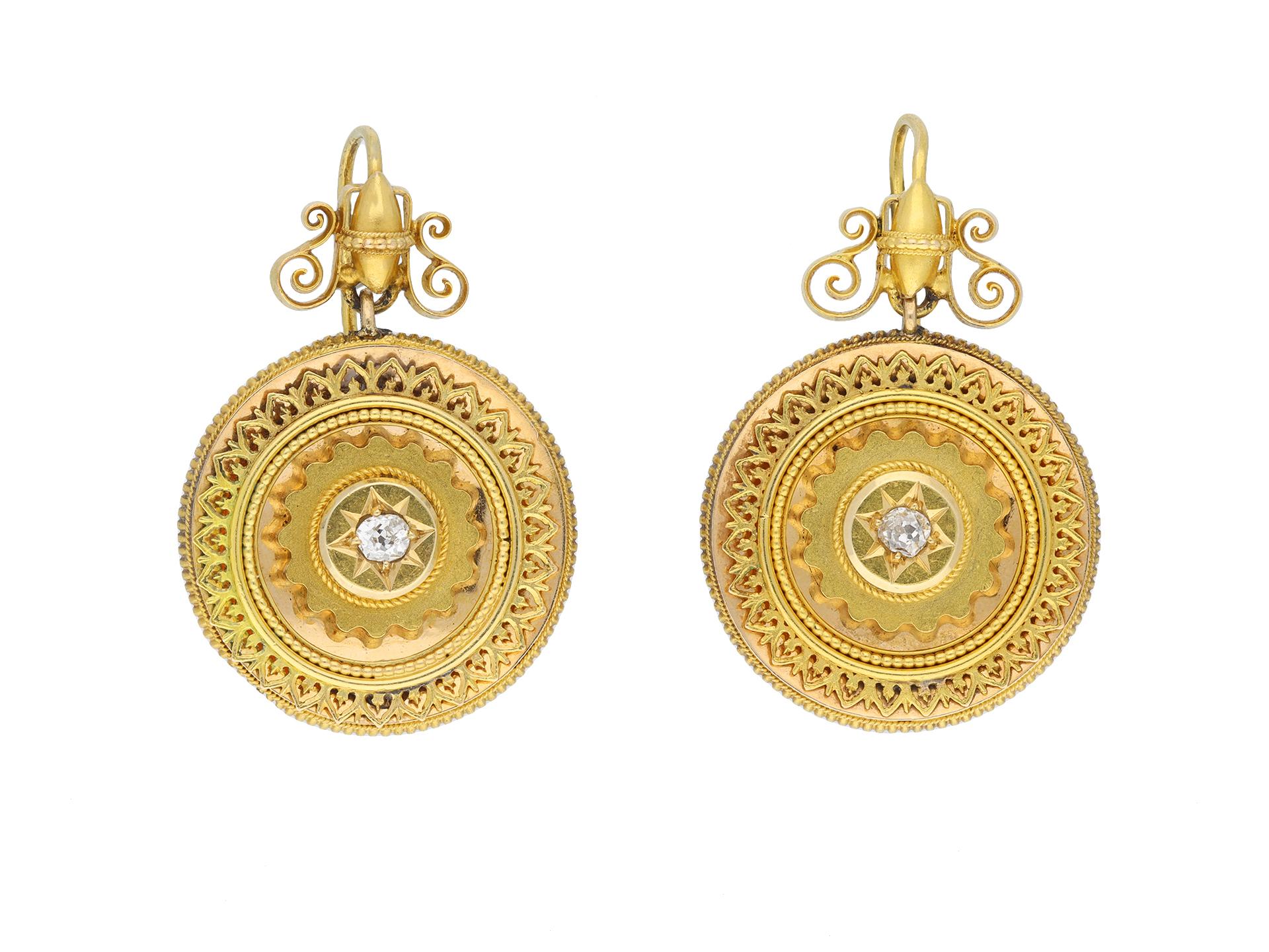 Victorian diamond set brooch and earring suite. A diamond suite of jewellery comprising earrings and a brooch. The brooch set to centre with a cushion shape old mine diamond in a closed back grain setting with an approximate weight of 0.40 carats,