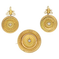 Victorian diamond set brooch and earring suite, circa 1860.