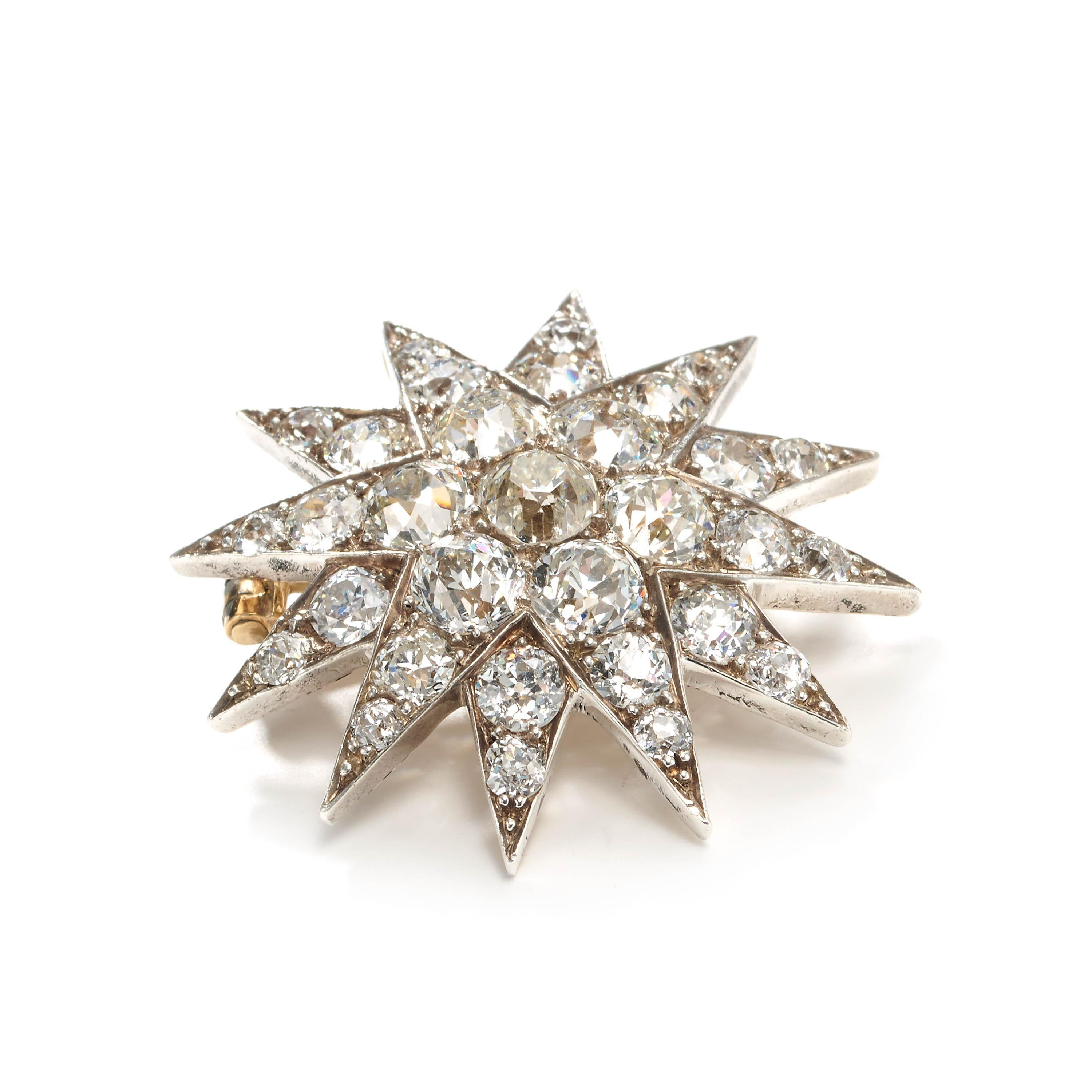A Victorian diamond star brooch, with twelve points, set with European-cut diamonds, with an estimated total weight of 7.00ct, with an old-cut diamond, in the centre, weighing approximately 0.83ct, in grain settings, with a surrounding cluster of