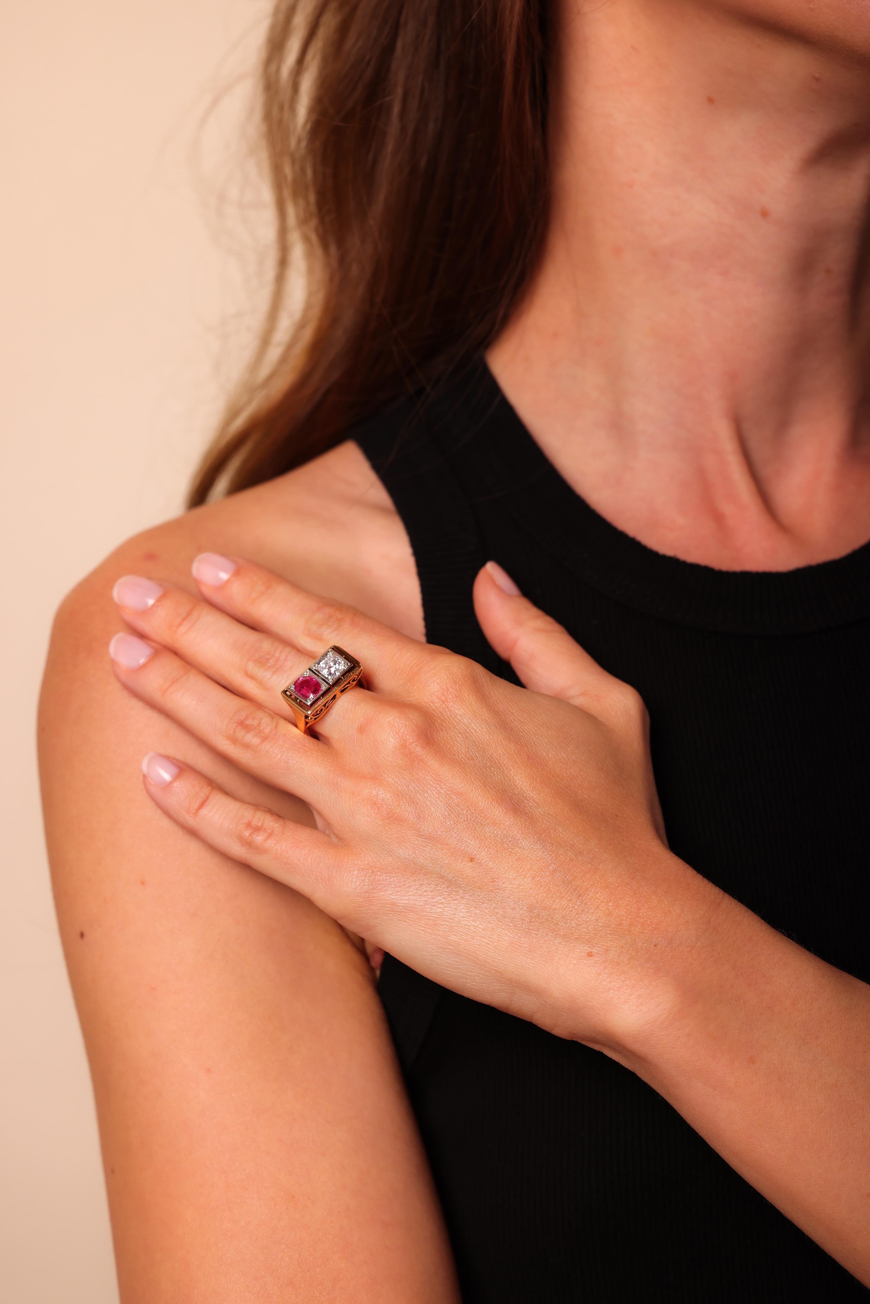 Center Stone: Synthetic Ruby
Cut: Oval Cut
Weight: Approximately 1.1 Carat
Color: Pinkish Red
Accent Stone: Diamond
Cut: Old Mine Cut
Weight: Approximately 0.90 Carat
Color: H
Clarity: SI2
Metal: 14K Yellow Gold and Silver
Era: Edwardian
Circa:
