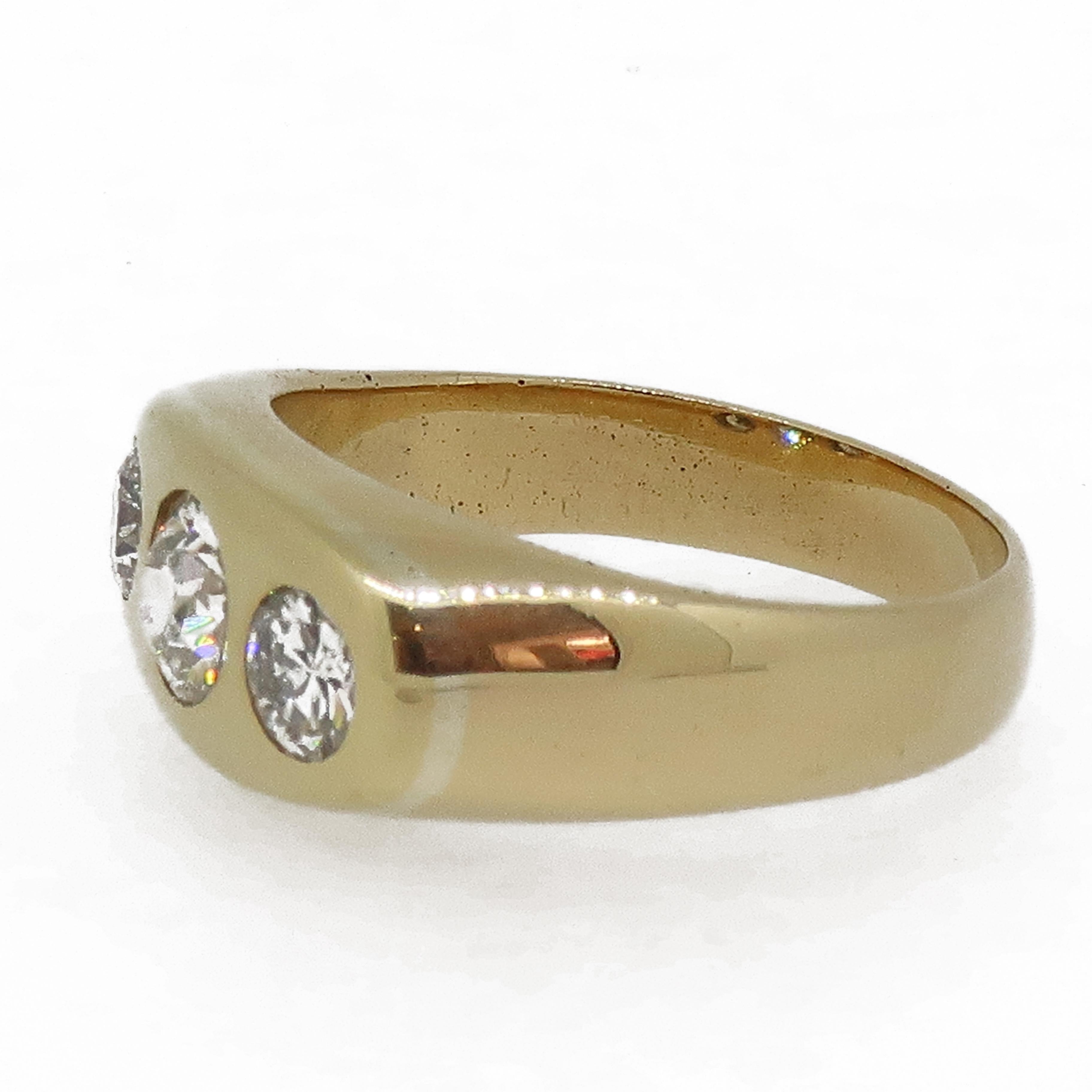 Victorian Diamond Three-Stone Ring 18 Karat Yellow Gold

A smart 18ct gold ring that has been set with three old cut diamonds that are a good evenly matched in colour with a few marks visible to the eye. There is a larger diamond in the centre and