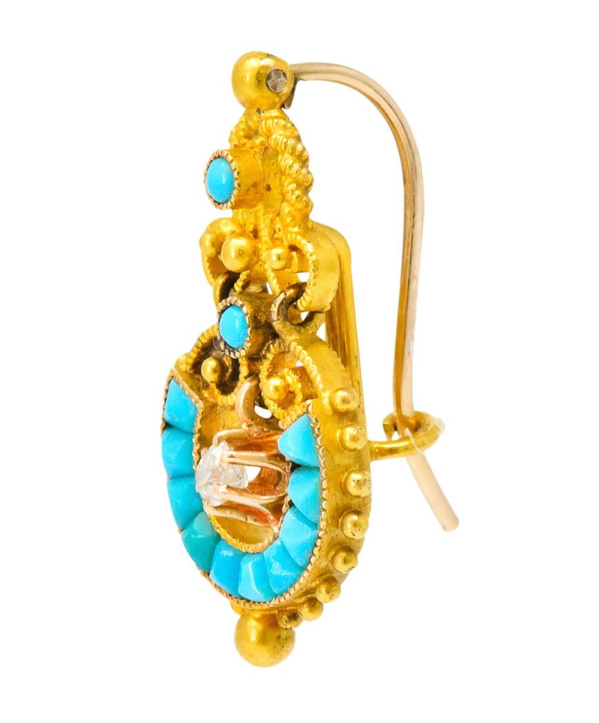 Each centering an articulated, claw set, old mine cut diamond, weighting approximately 0.20 carat total, eye-clean 

Accented with round cabochon and calibré cut turquoise

Textured scrolling and polished gold bead detailing

With French
