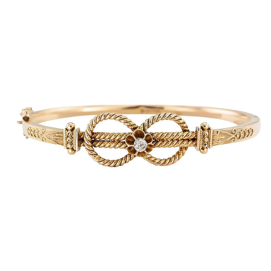 Victorian diamond and gold knot hinged bangle bracelet English circa 1890.  Love it because it caught your eye and we are here to connect you with beautiful and affordable jewelry.  Make yourself happy!  Simple and concise information you want to