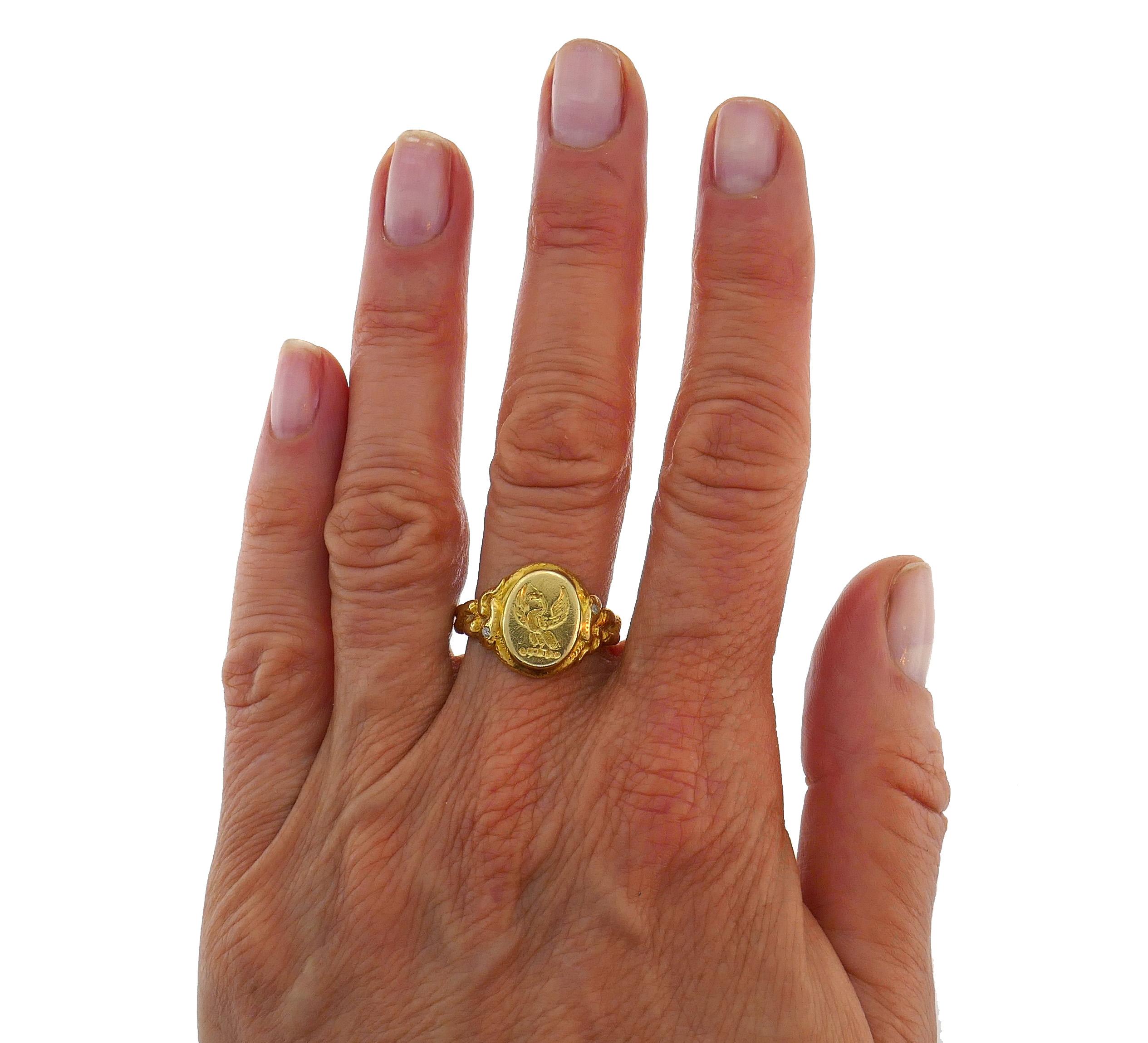 Gorgeous signet ring made of 14k yellow gold and accented with two Old European cut diamonds. 
Measurements: 9/16 x 1/2 inch (1.5 x 1.3 cm).
Weight 8.0 grams. 
The ring size is 9 (sizable). 