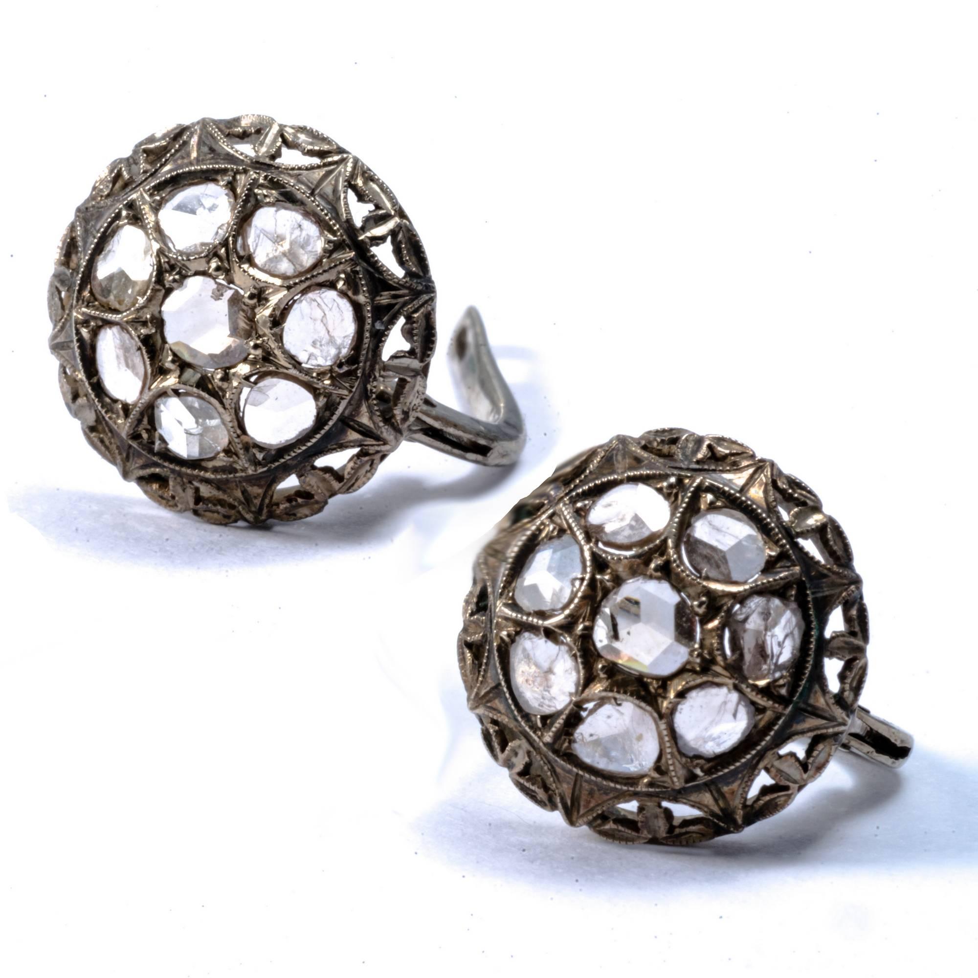 These early Victorian earrings  have a typical round,  dome shape. They are enlightened by 16 rose cut  and mixed cut diamonds. The filgree embellishments exemplifies the accuracy of the Victorian era craftmanship.
Earrings fitted for pierced ears.
