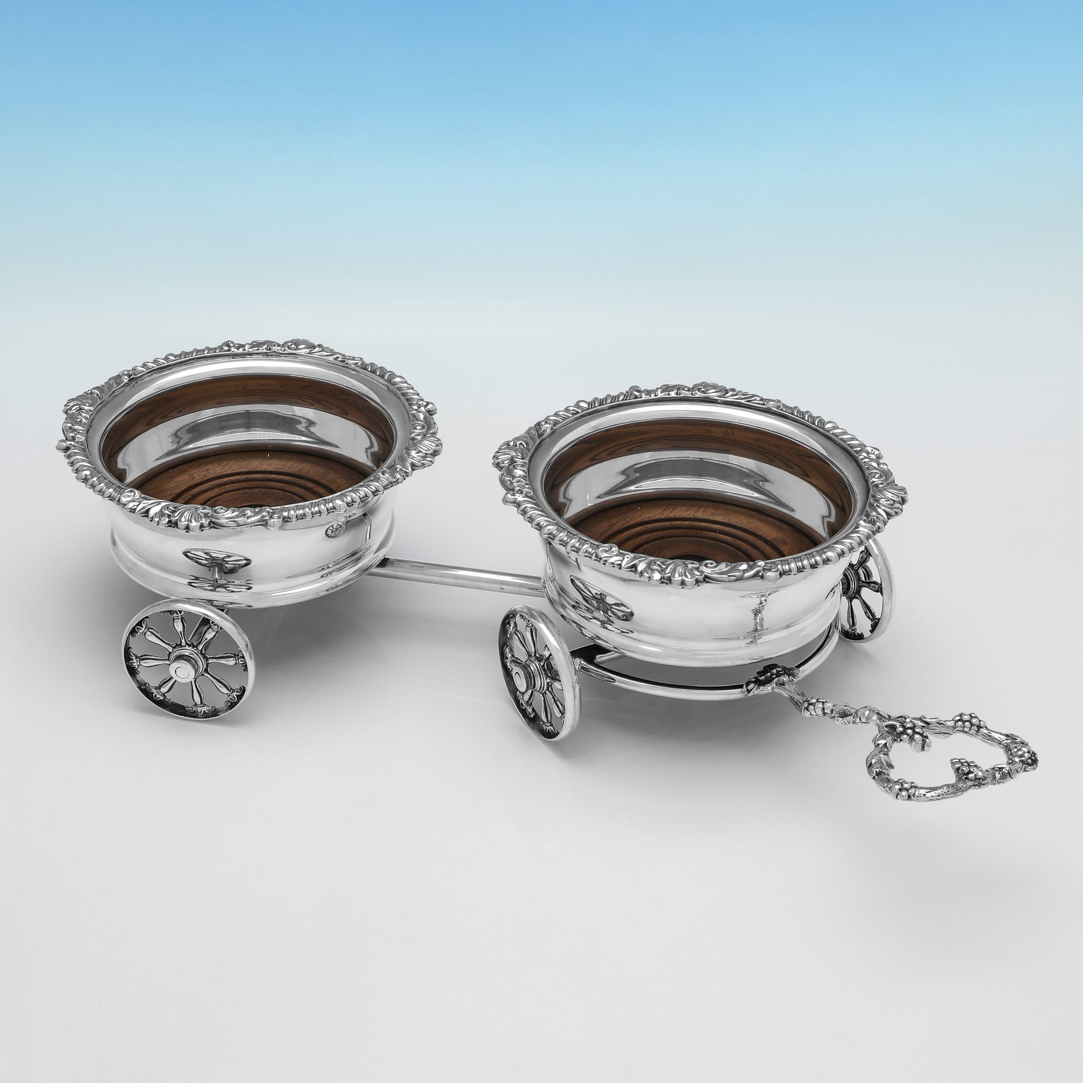 Made circa 1900, this late Victorian, Antique Silver Plate Decanter Trolley, will hold 2 bottles or decanters, and is ornate in design, with acanthus, shell and gadroon borders, and grape and vine detailing to the handle. The decanter trolley