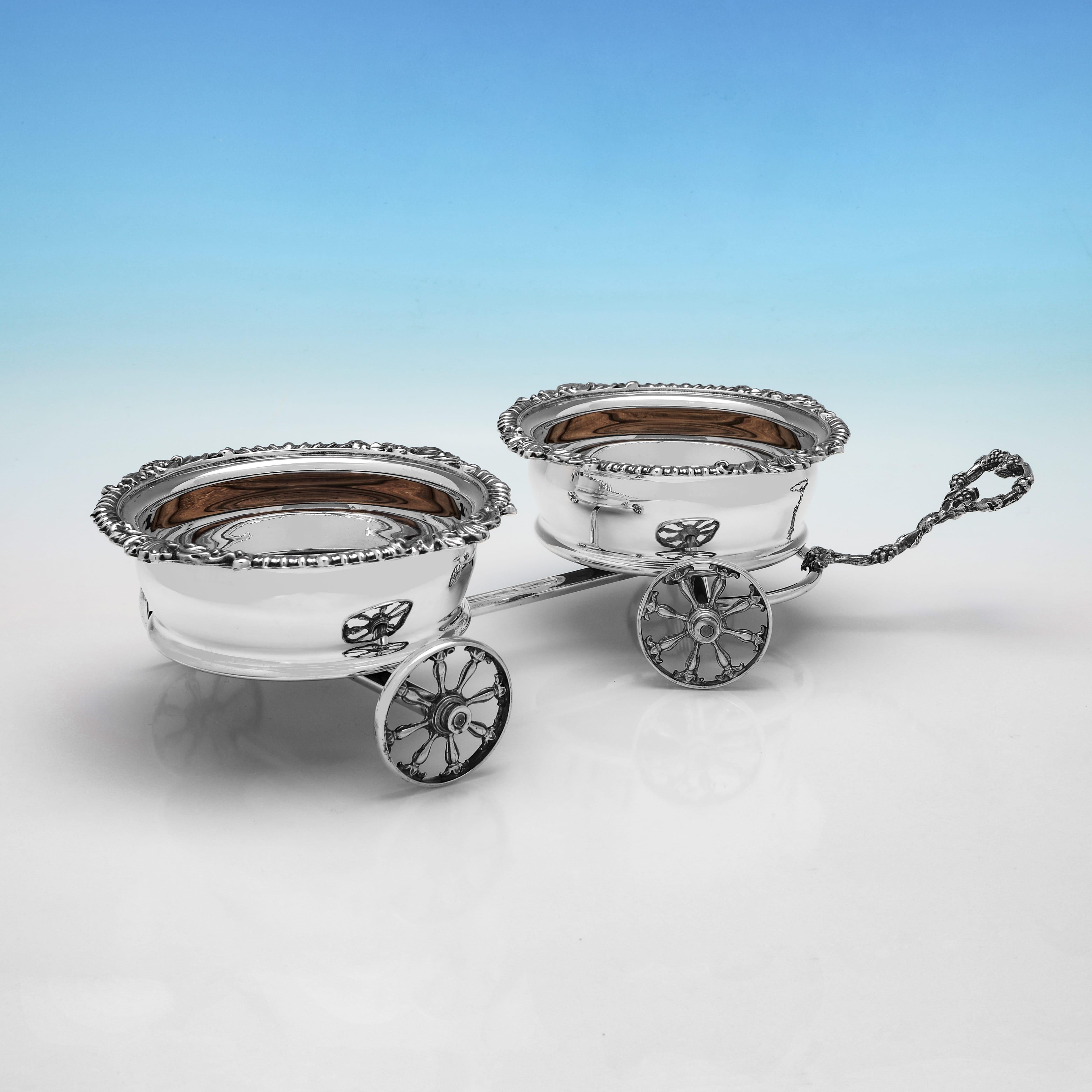 Made circa 1900, this late Victorian, Antique Silver Plate Decanter Trolley, will hold 2 bottles or decanters, and is ornate in design, with acanthus, shell and gadroon borders, and grape and vine detailing to the handle. The decanter trolley