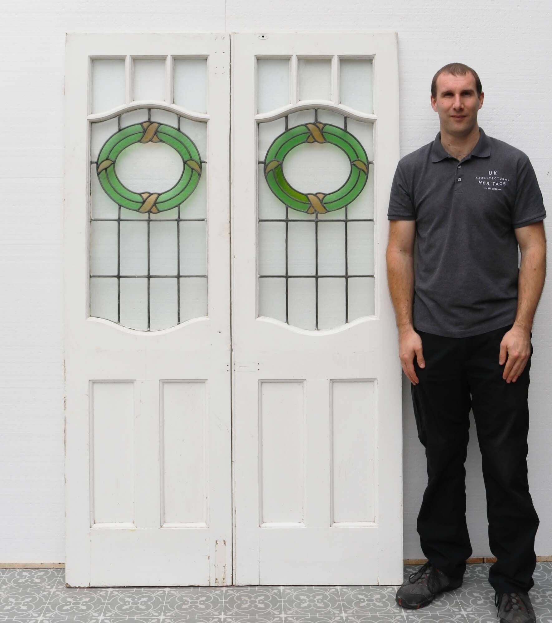 You can imagine these early 20th century front doors with stained glass sitting proudly at the porch of a large Victorian townhouse. At over 100 years old, each door features original leaded glass with no cracks. It is a simple, elegant design